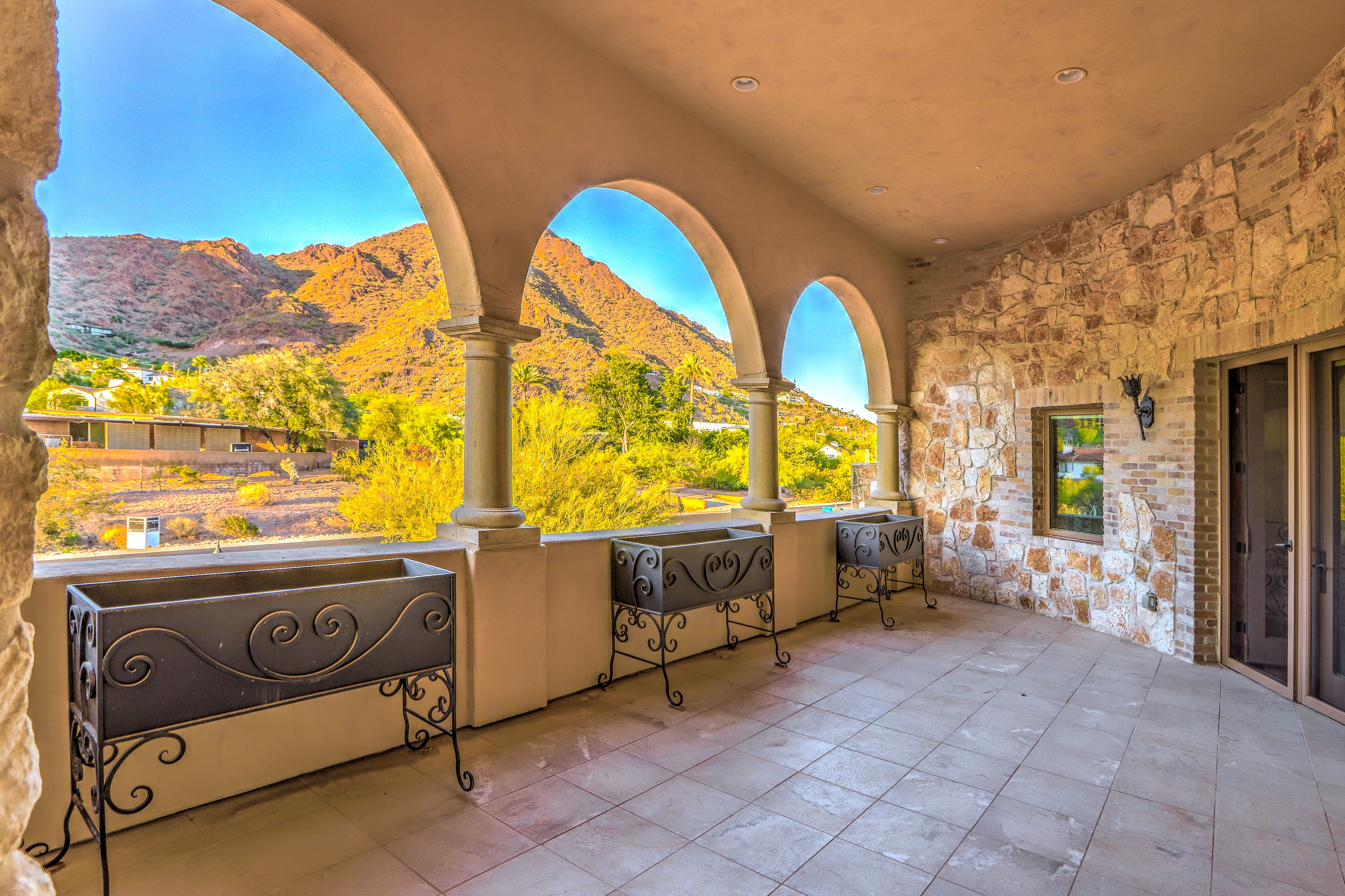 A patio overlooking a mountain. 