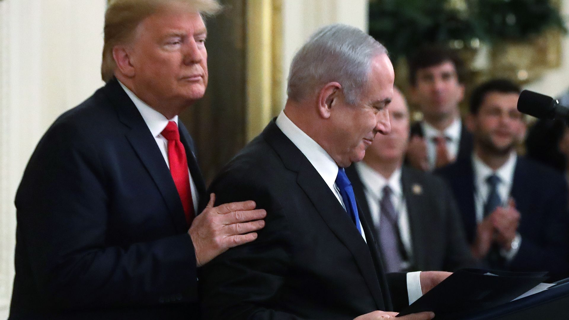 Trump standing behind Netanyahu at podium