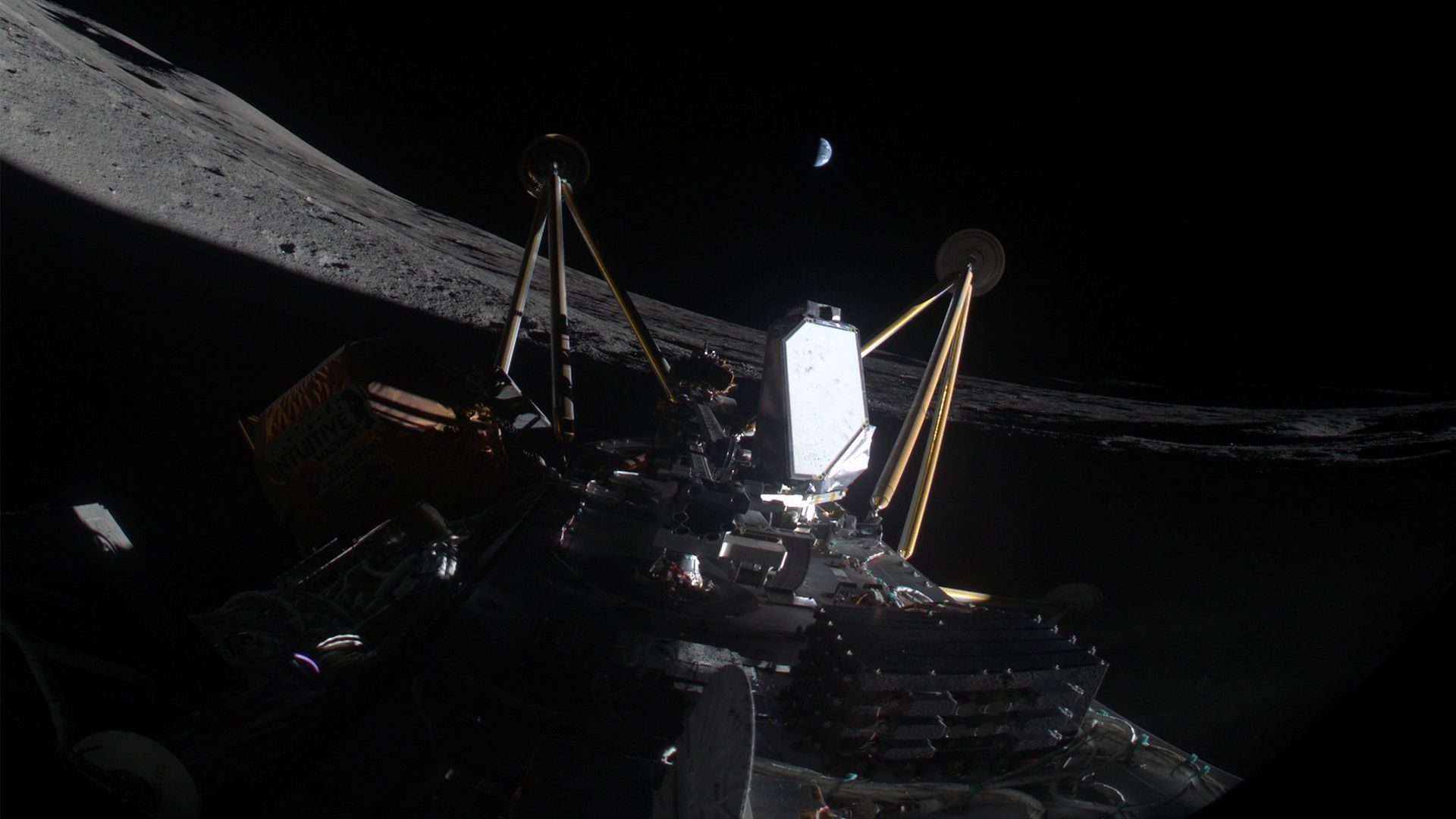 A spacecraft appears to have landed on its side on the moon. It was pitch black around, but earth can be seen from a distance