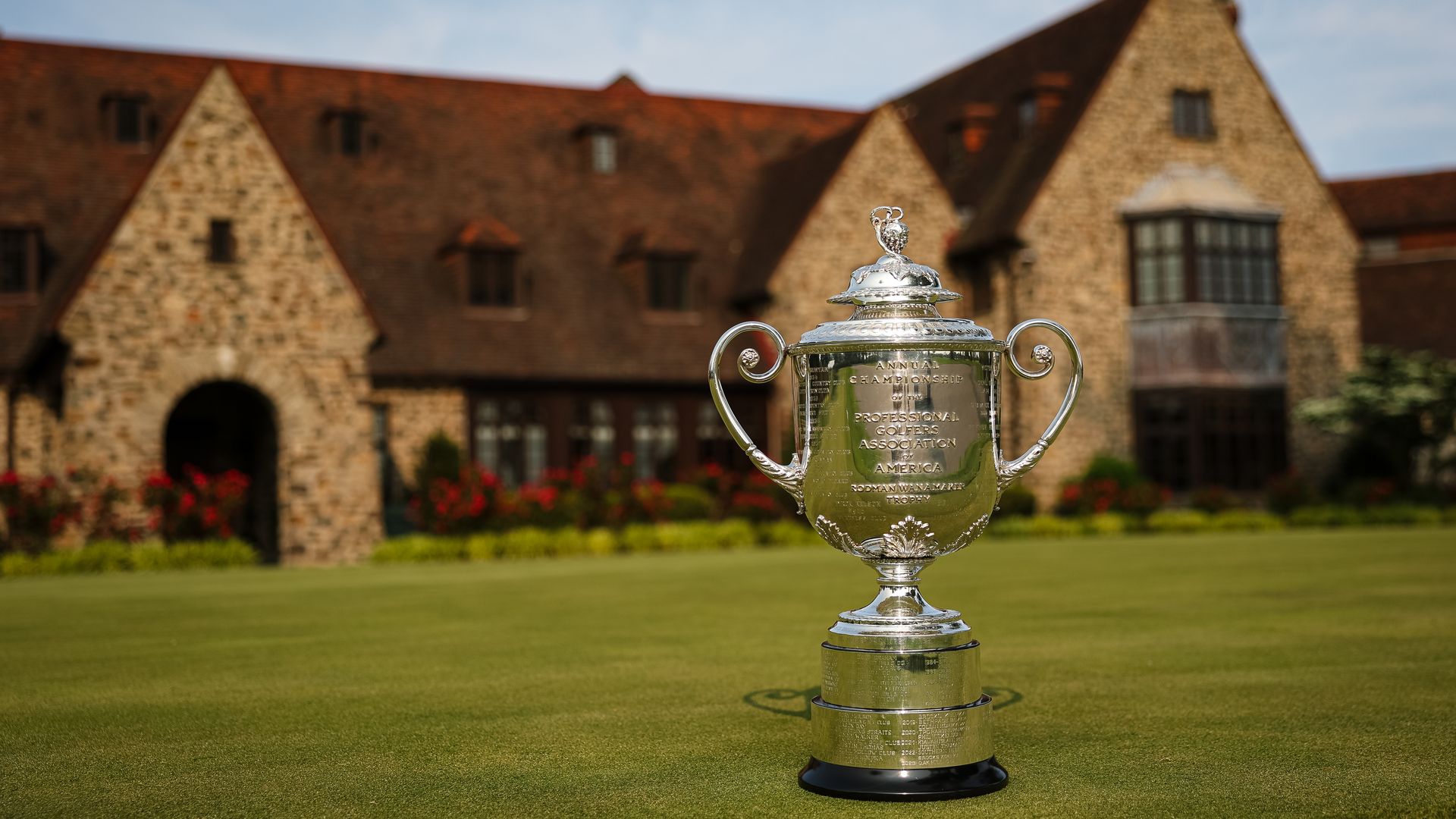 A view of the Wanamaker Trophy in front of the clubhouse at the Aronimink Golf Club.