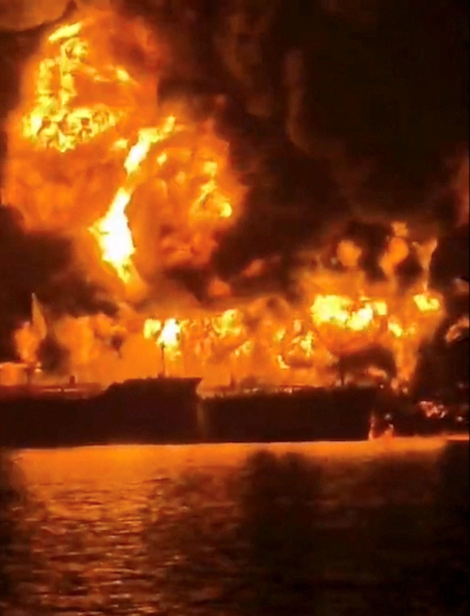 An oil tanker on fire after an apparent Iranian attack in Iraqi waters.