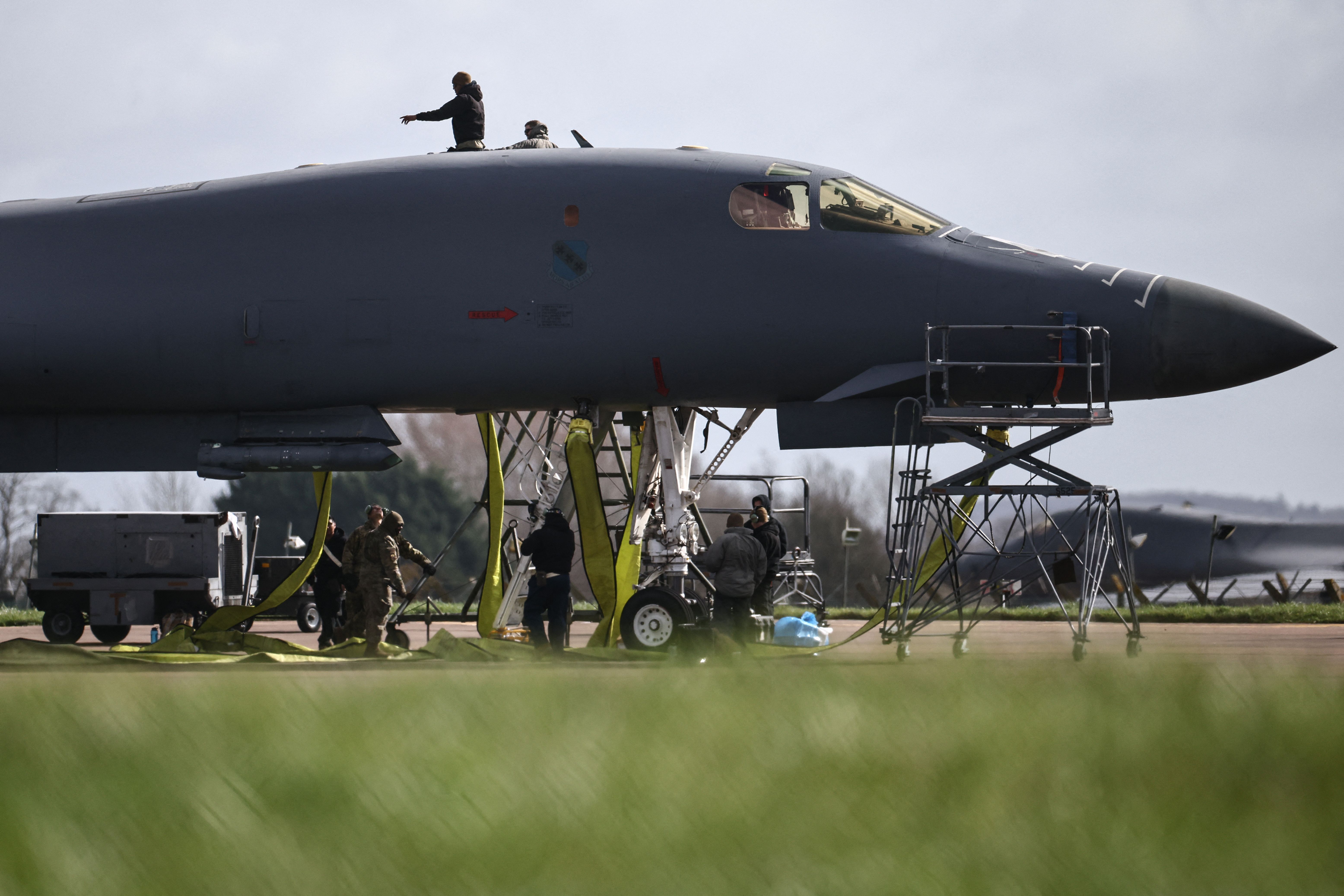 Military personnel work on a U.S. Air Force B-1 Lancer bomber at RAF Fairford in Gloucestershire, England today. Photo: Henry Nicholls/AFP via Getty Images