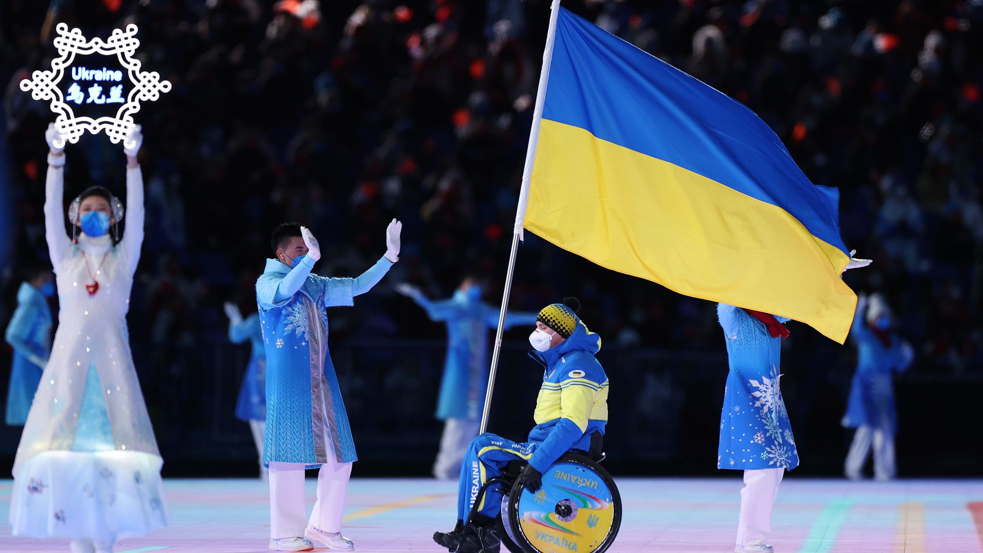 Flag bearer Maksym Yarovyi of Team Ukraine leads their team out during the Opening Ceremony of the Beijing 2022 Winter Paralympics