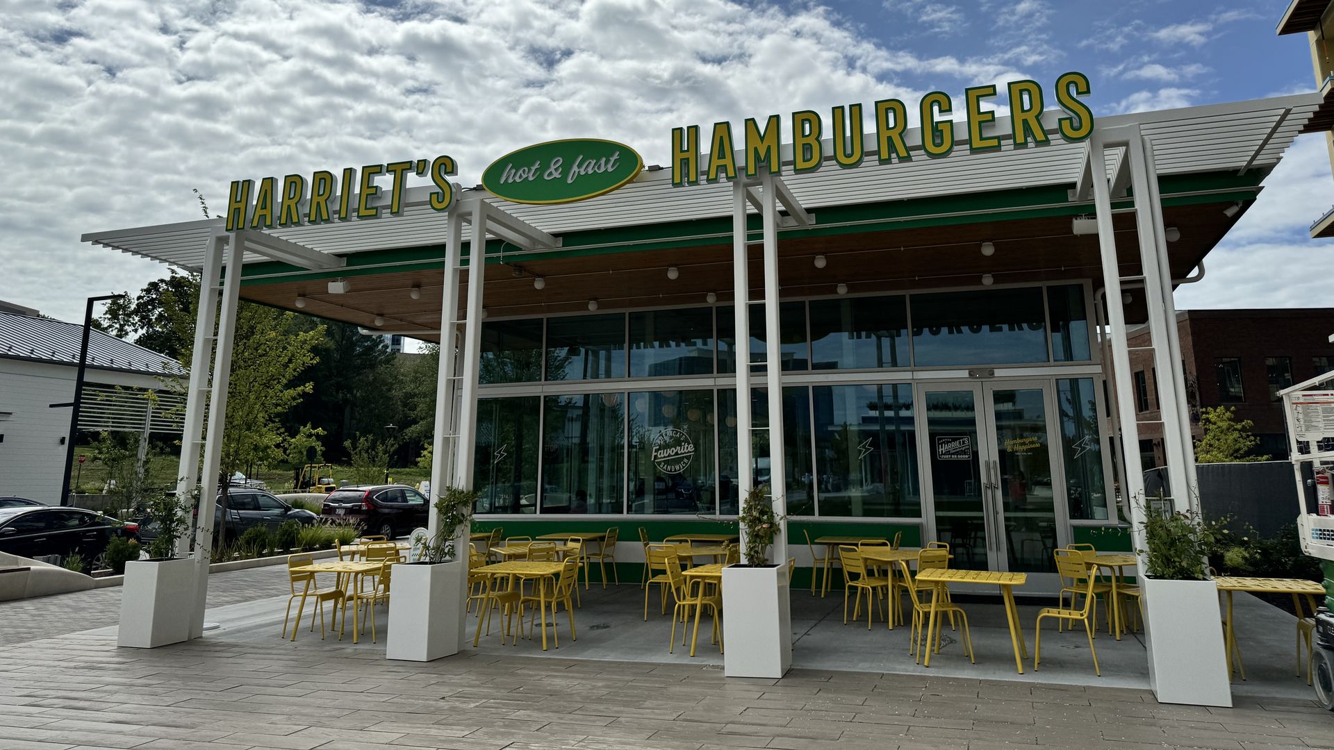 outside of Harriet's hamburgers restaurant with an outdoor patio