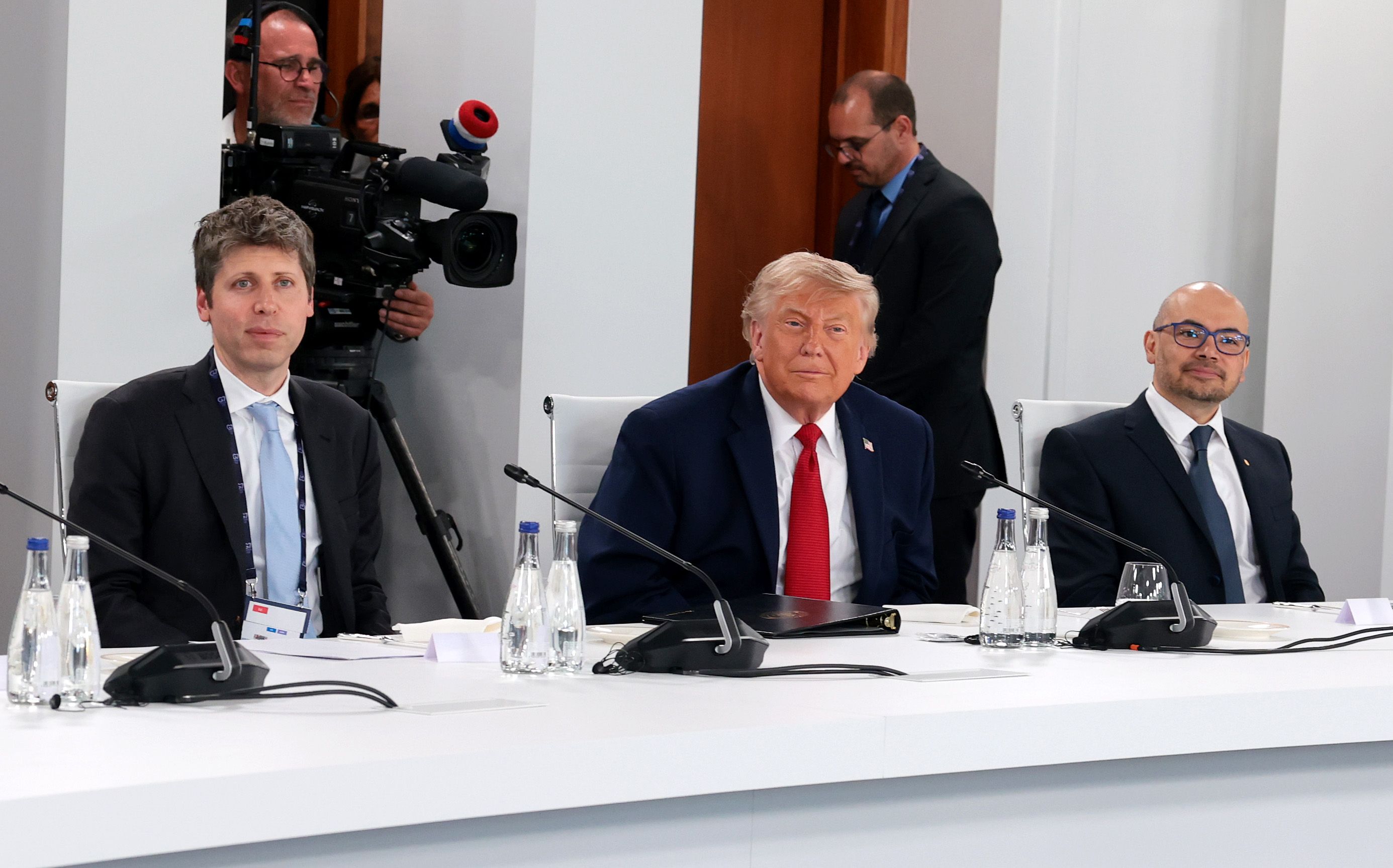 OpenAI CEO Sam Altman, President Trump and Google DeepMind CEO Demis Hassabis attend a working lunch at the G7 summit in France yesterday.