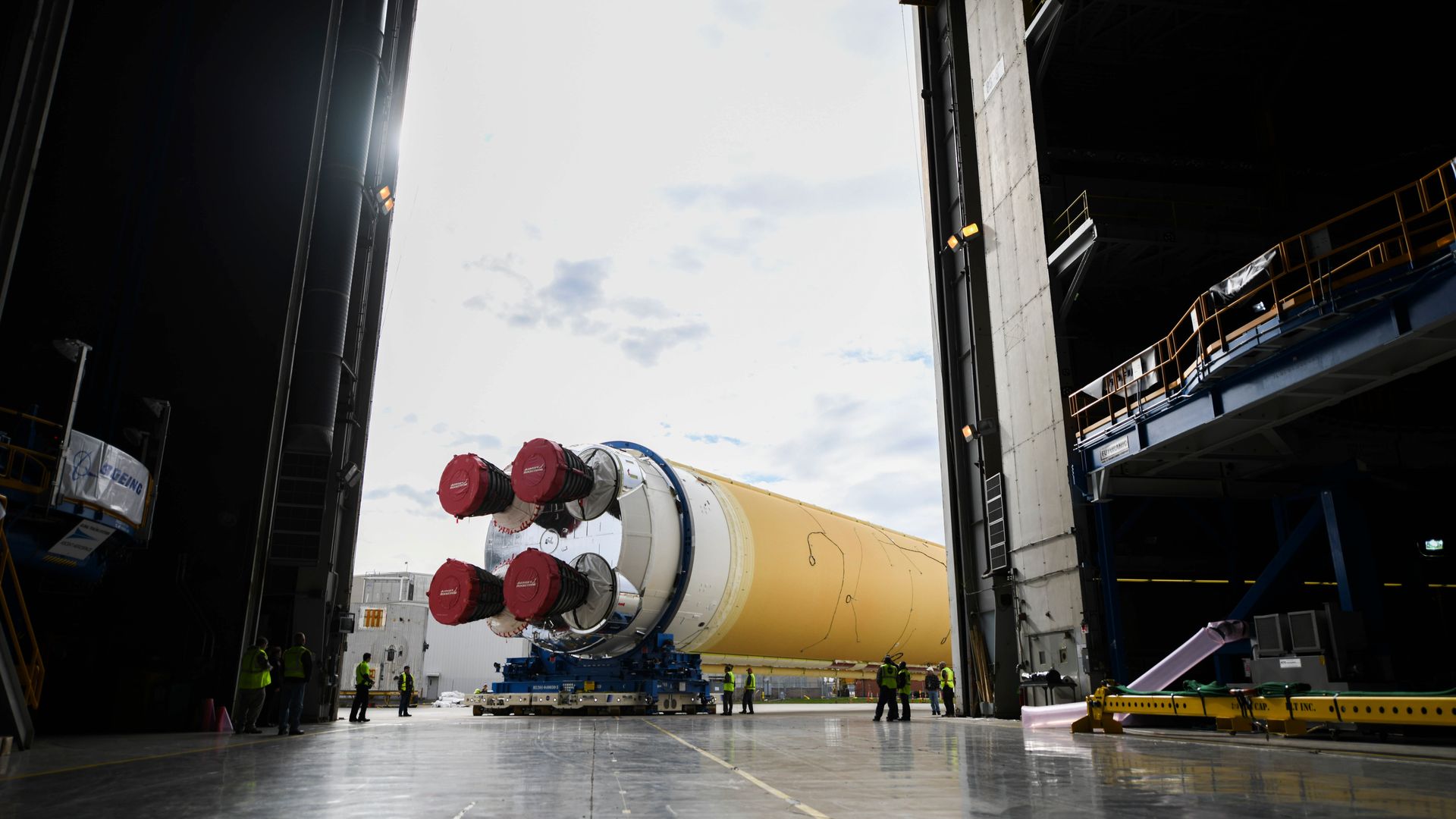 A large rocket outside a warehouse