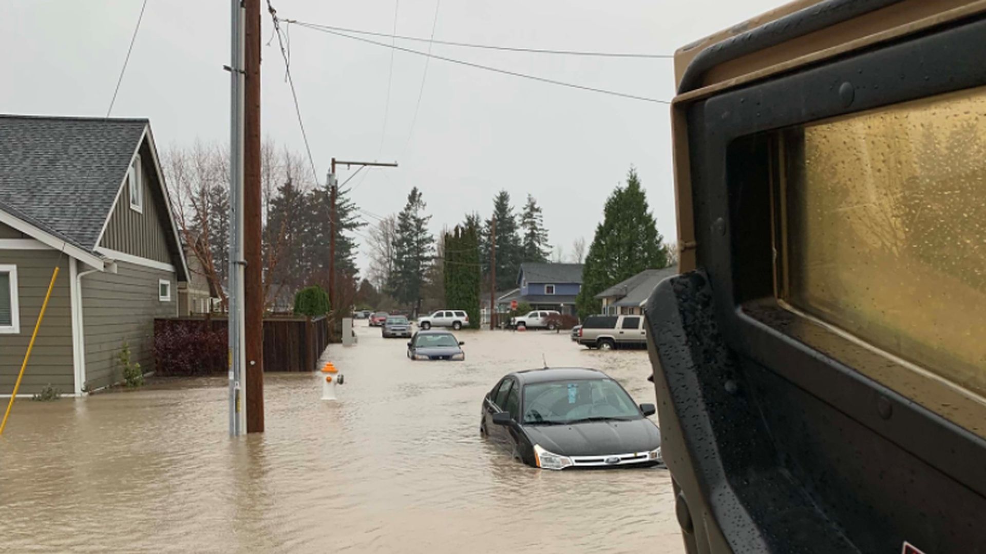 Whatcom County Sheriff's Office deputies evacuate stranded residents in  in the Everson area of Washington State.