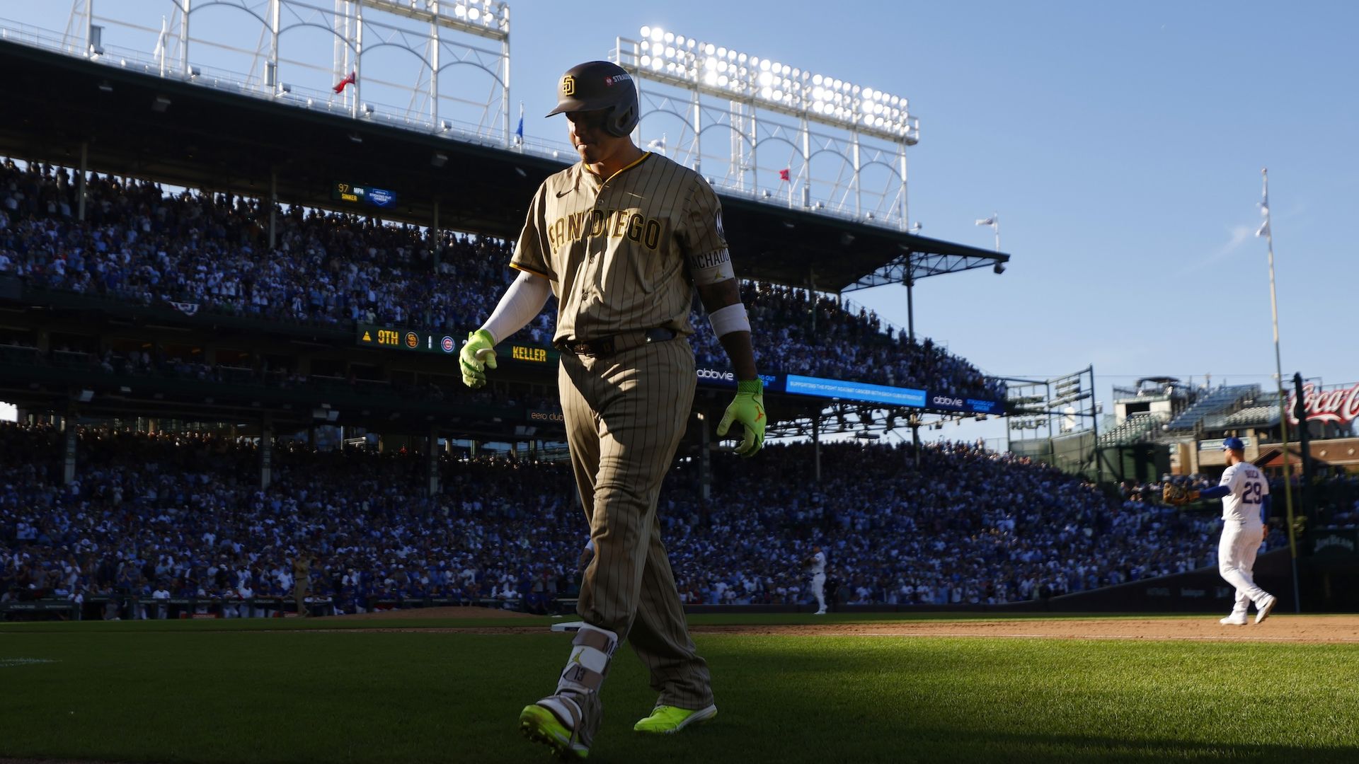 Padres player Manny Machado walks back to the dugout with his head down during Game 1 of the NL Wild Card Series at Wrigley Field. 