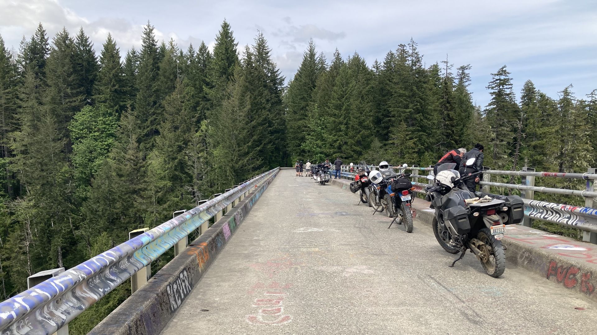 A photo of a line of motorcycles parked on a bridge in Washington state. 