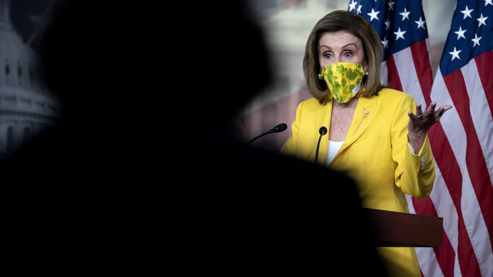 House Speaker Nancy Pelosi is seen speaking with reporters during her weekly news conference.