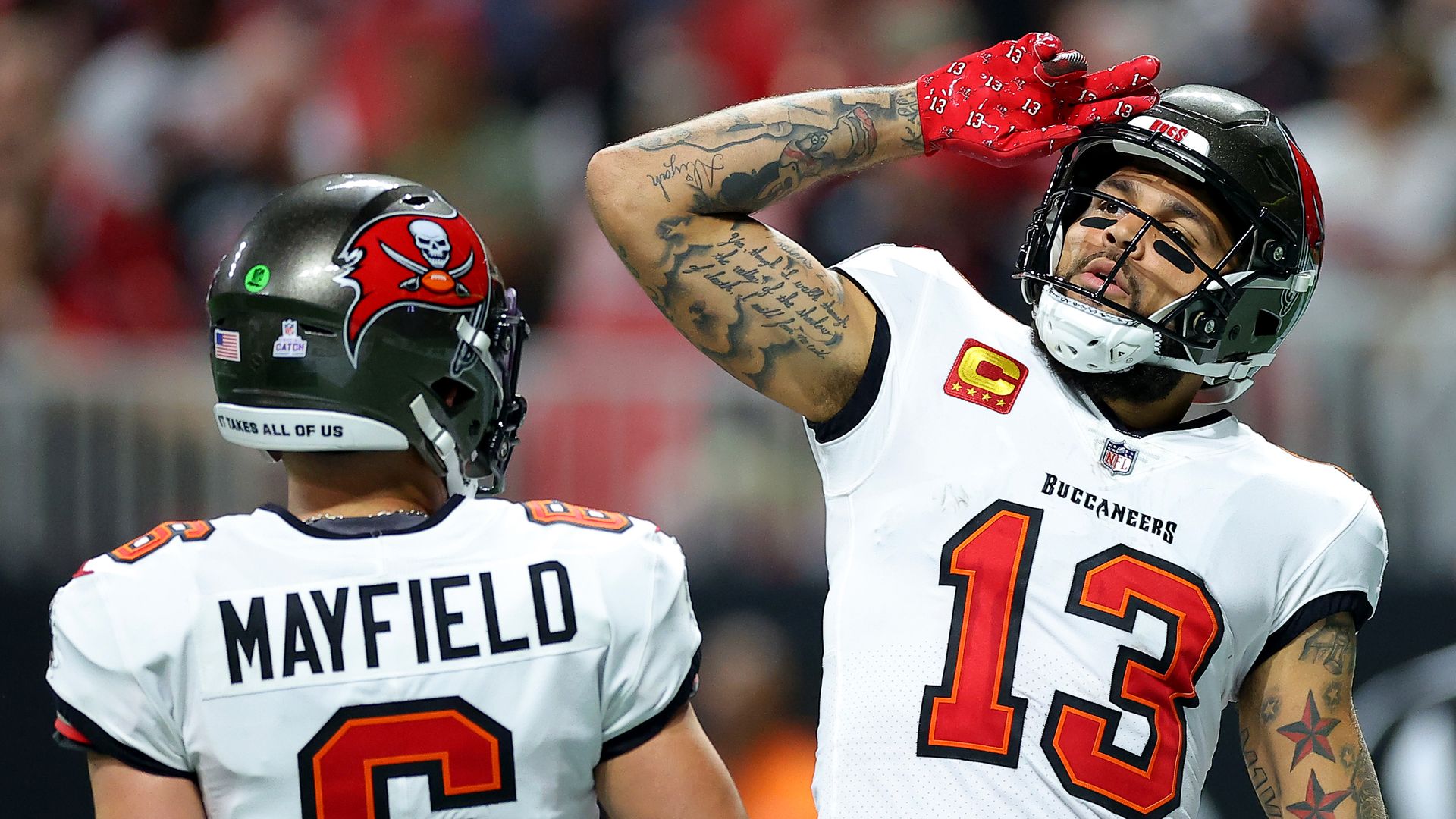 Mike Evans #13 of the Tampa Bay Buccaneers celebrates with Baker Mayfield #6 after scoring a touchdown against the Atlanta Falcons during the second quarter at Mercedes-Benz Stadium on October 03, 2024 in Atlanta, Georgia. 