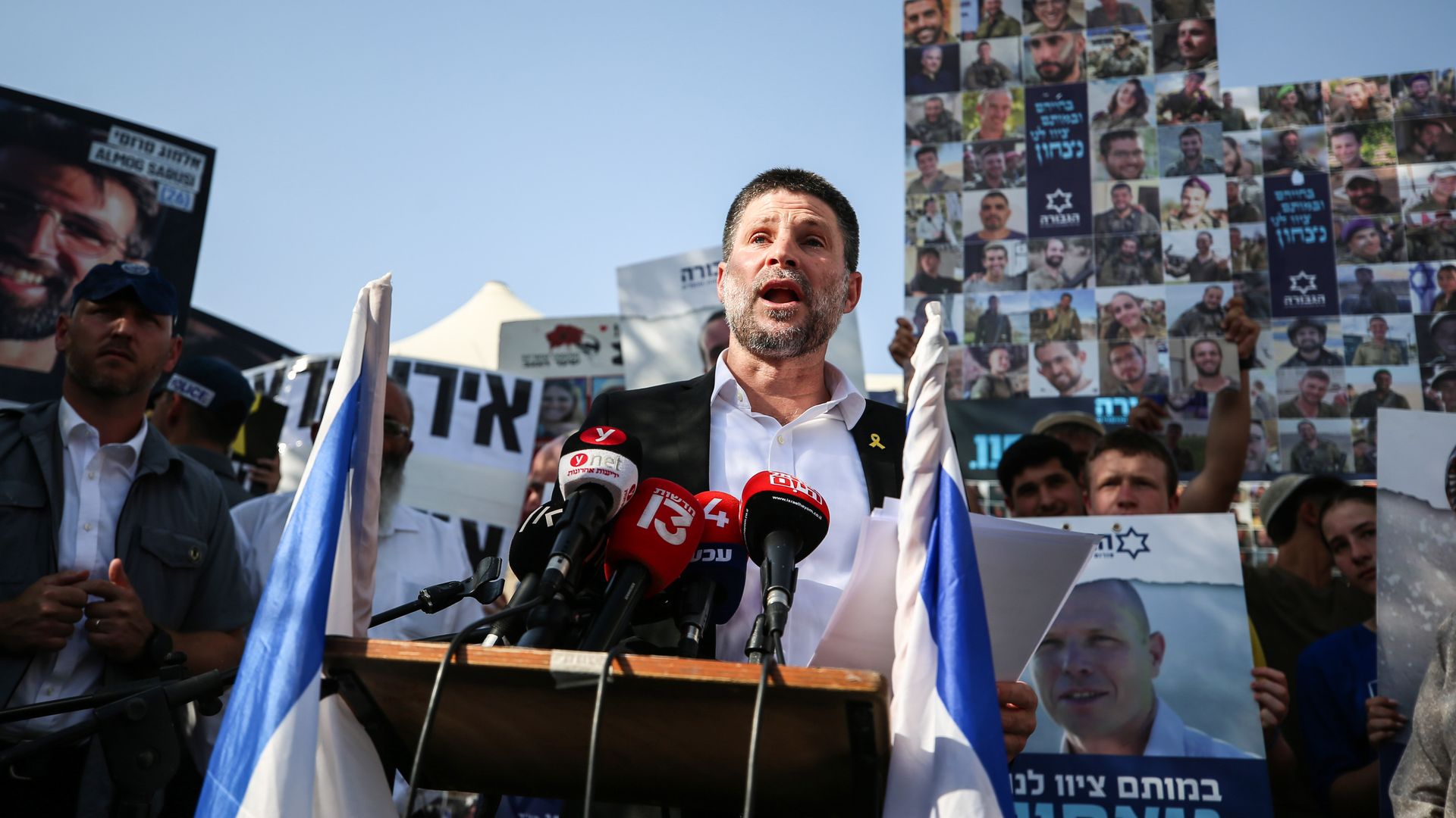  Israel's Finance Minister Bezalel Smotric addresses the relatives of Israelis being held hostage during a rally.