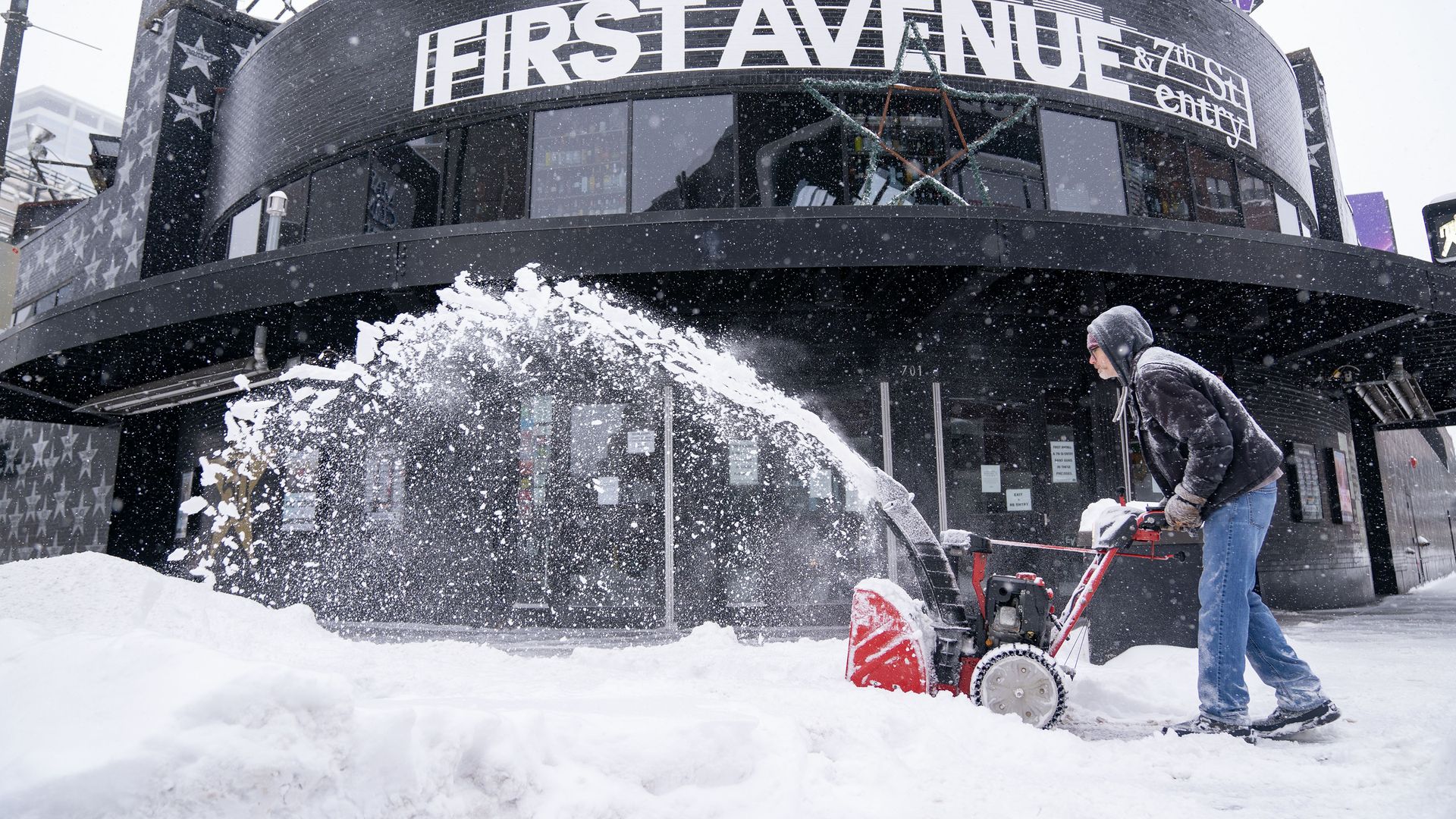 Bryan Erickson clears snow in front of First Avenue nightclub Thursday, Feb. 23, 2023 in downtown Minneapolis, Minn.