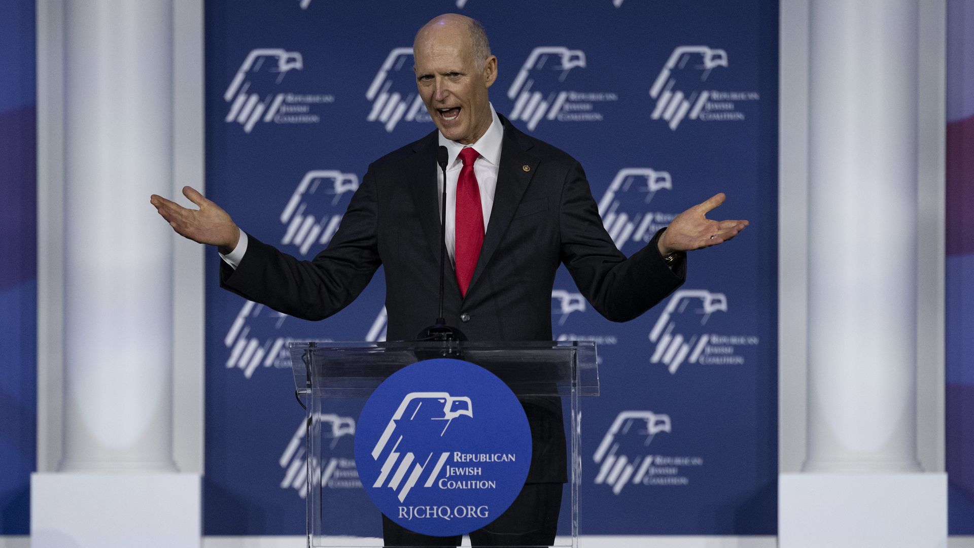 Sen. Rick Scott is seen delivering a speech.