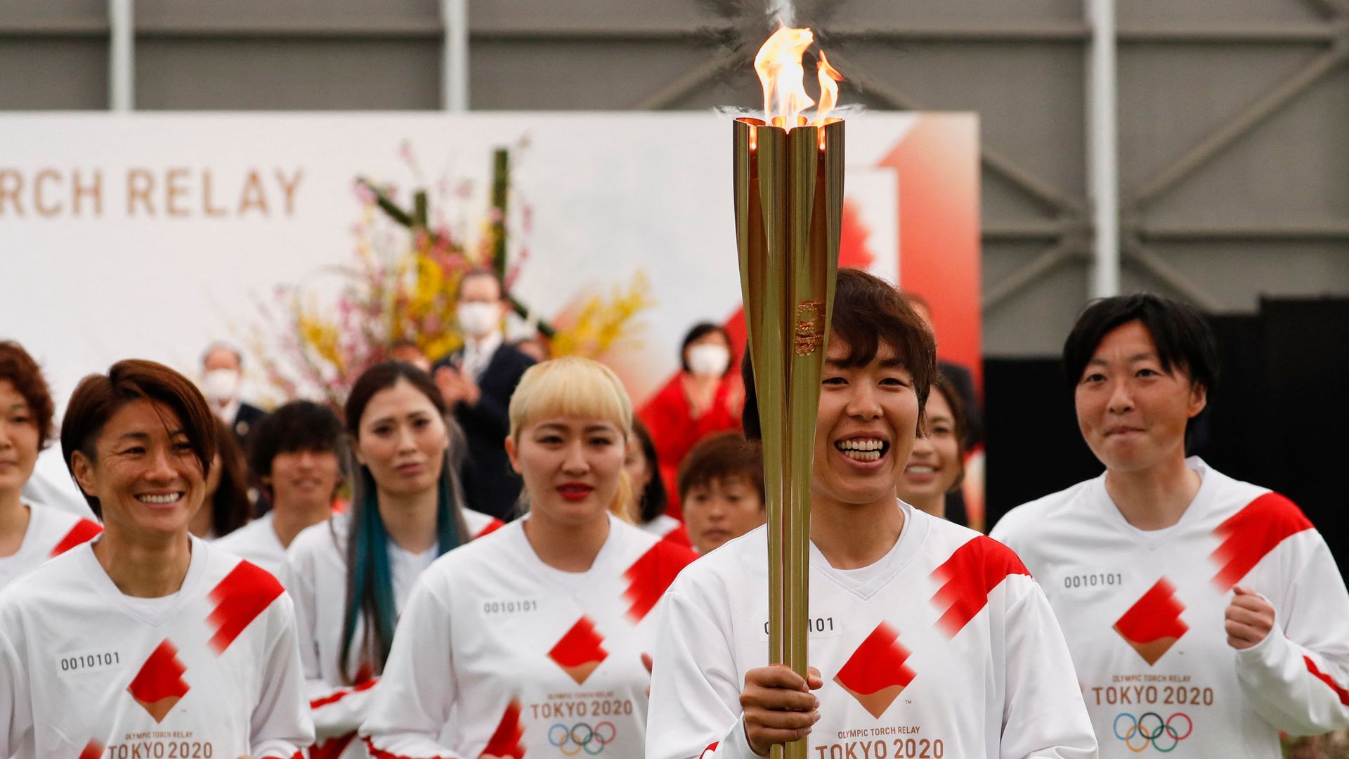 Tokyo 2020 Olympic Torch Relay Grand Start torchbearers from Japan's women's national soccer team, or Nadeshiko Japan, lead the torch relay in Naraha, Fukushima prefecture on March 25