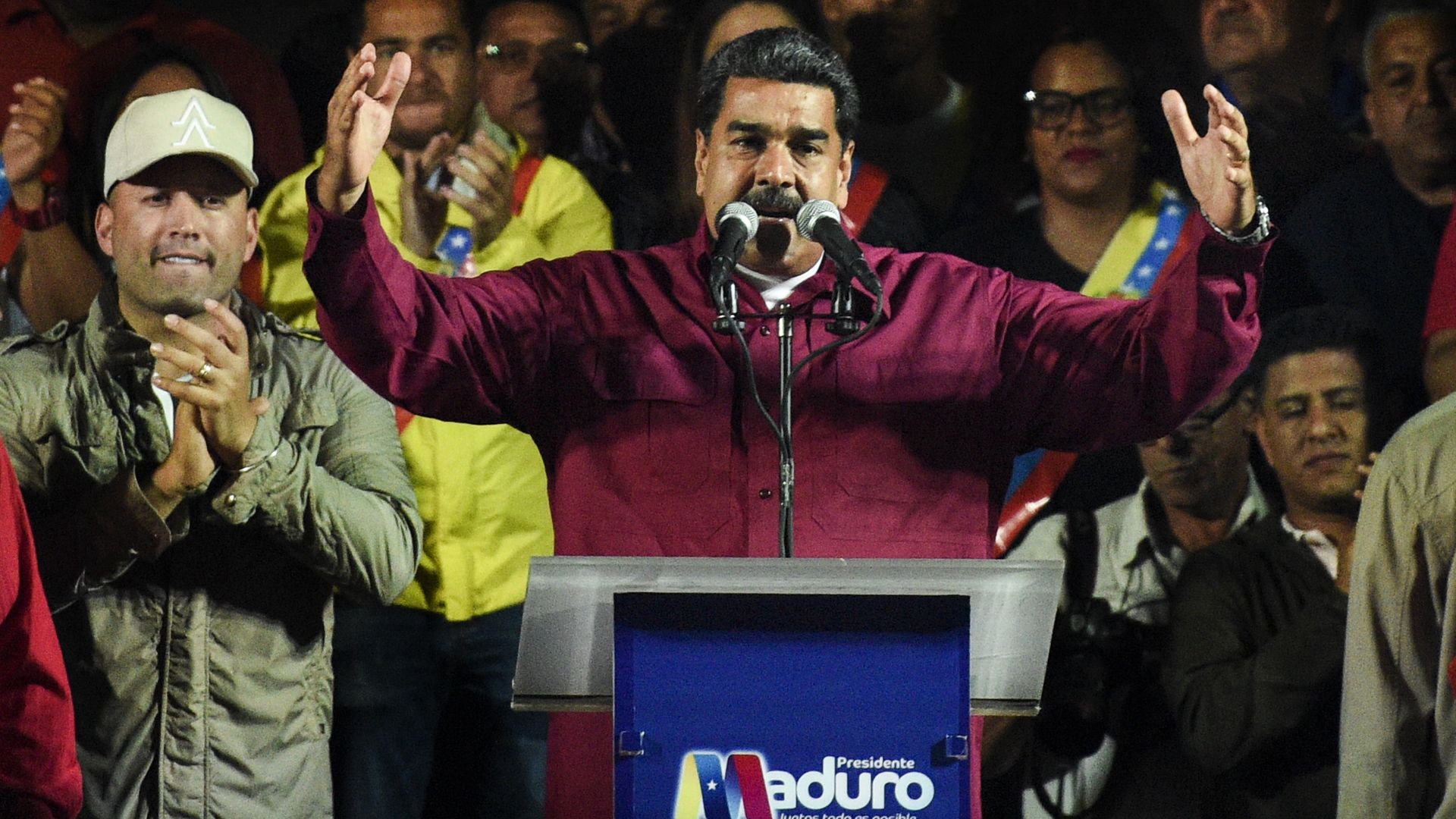 Venezuela's President, Nicolas Maduro, talks to his followers after announcing his reelection 