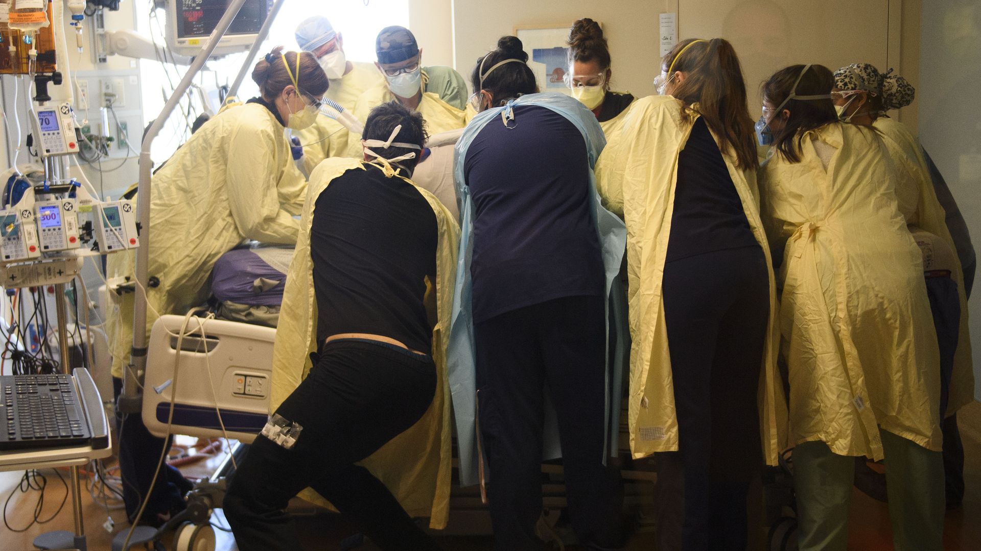A team of health care workers turning a patient from their stomach onto their back in the Covid-19 intensive care unit (ICU) at Renown Regional Medical Center on December 16, 2020 in Reno, Nevada. 