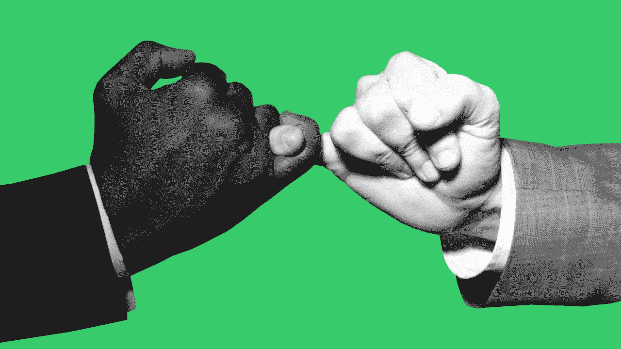 Image of a handshake being pulled apart