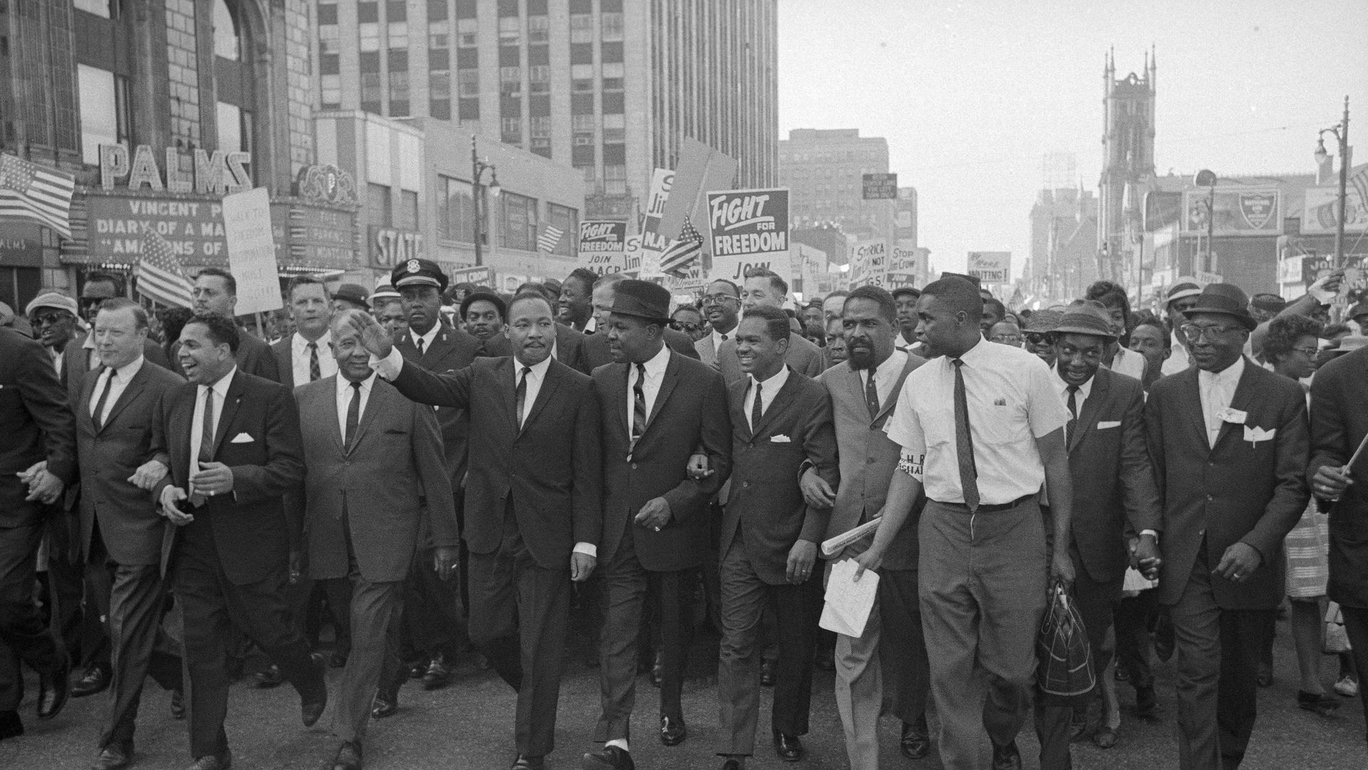 Reverend Martin Luther King Jr. leads parade through downtown Detroit. (Bettman Archive/Getty)