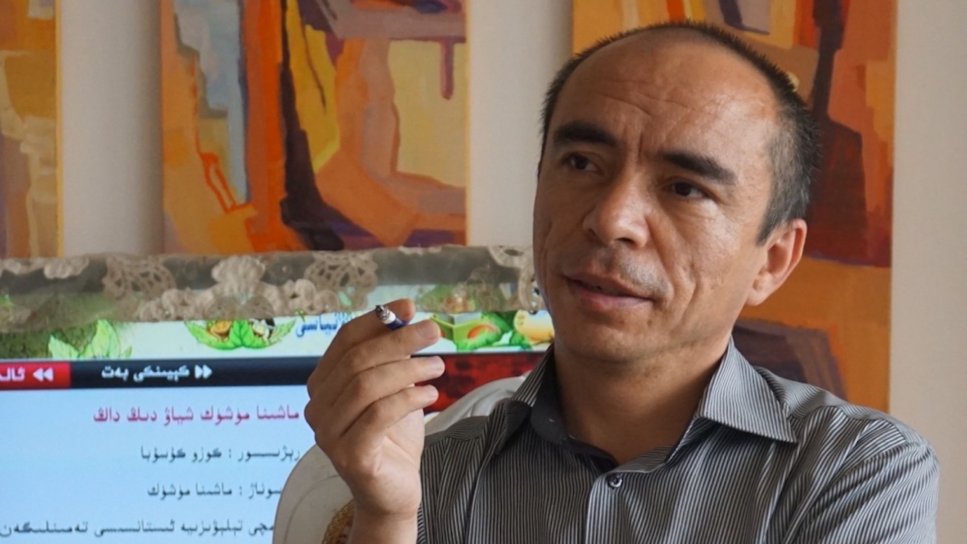 Perhat Tursun in his home in Urumqi in 2015