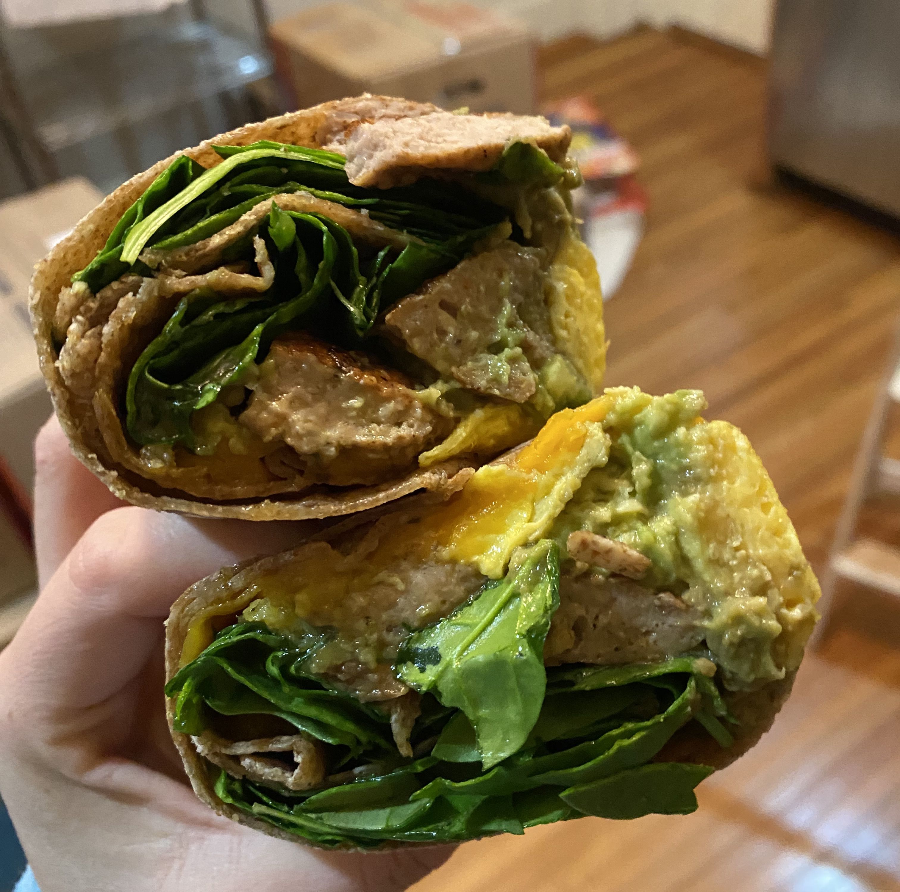 hand holding a burrito