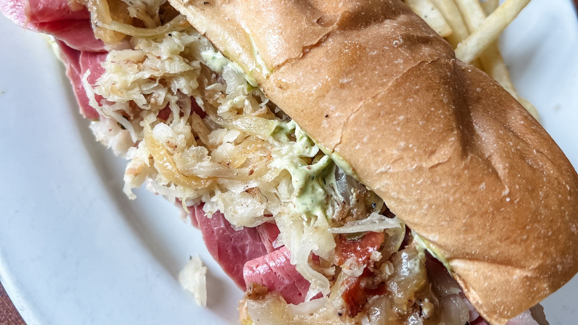 Photo shows a corned beef poboy.