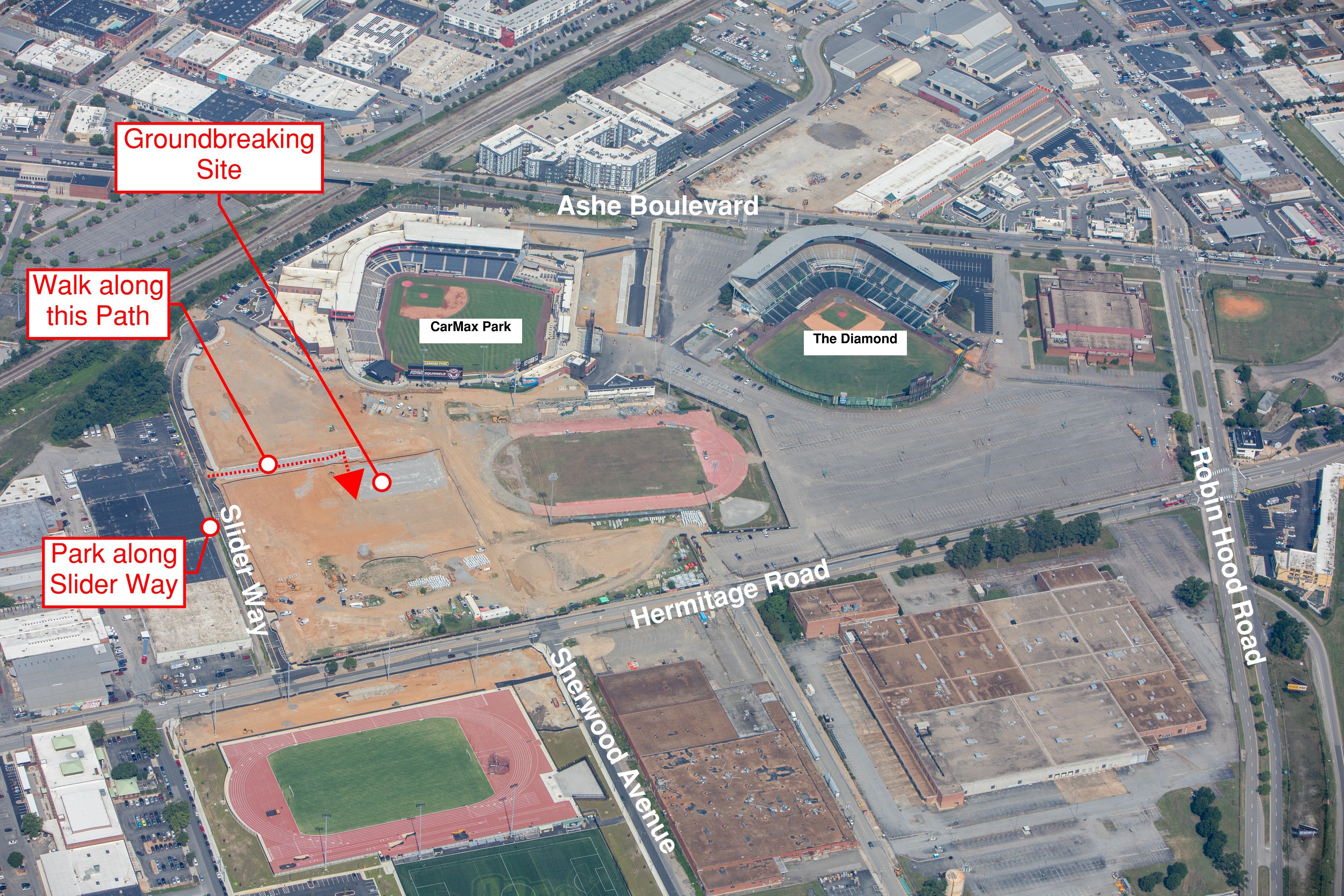 Aerial view of a stadium complex with CarMax Park and The Diamond field. Red callouts mark a Groundbreaking Site, a walk path, and a Park along Slider Way near Ashe Boulevard.