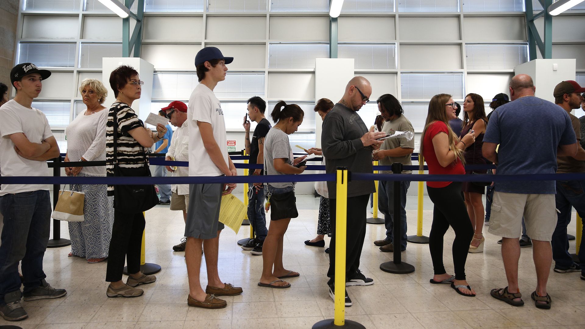 A photo of people in line at the DMV.