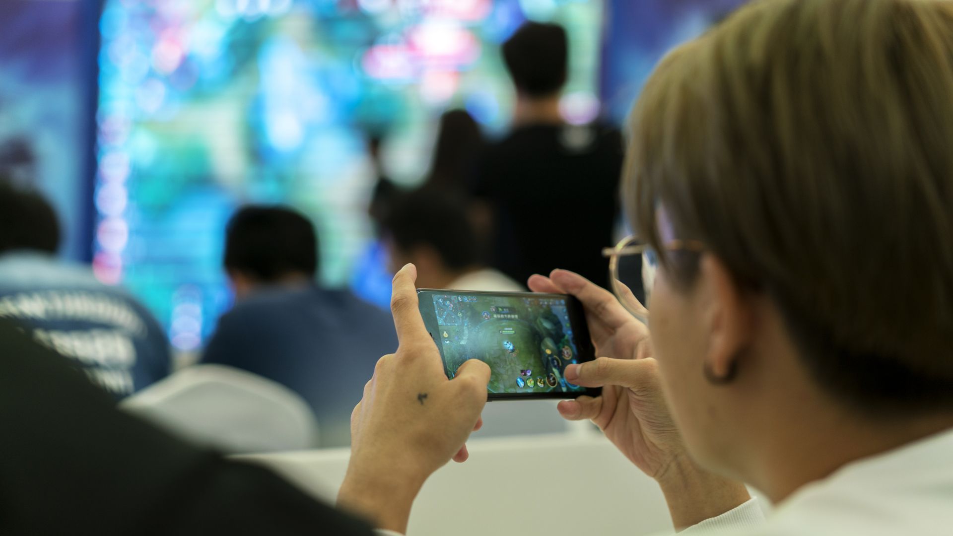 Young players compete in a battle match of the mobile game Arena of Valor, held in a shopping mall, on Oct. 1, 2017 in Tianjin, China. Zhang Peng/LightRocket via Getty Images