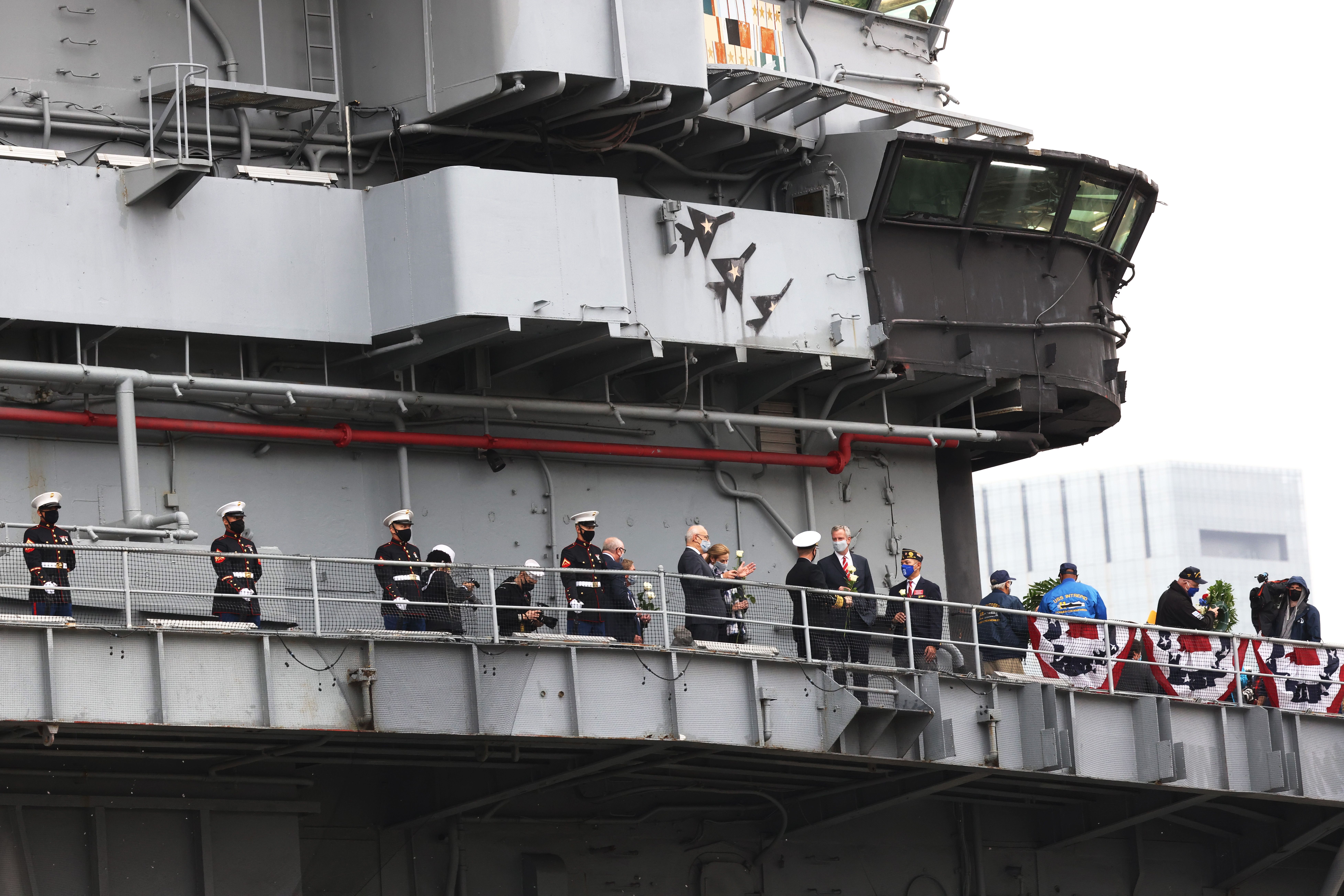 People join New York City Mayor Bill de Blasio for a Veteran's Day ceremony aboard the Intrepid Museum on November 11, 2020 in New York City. 