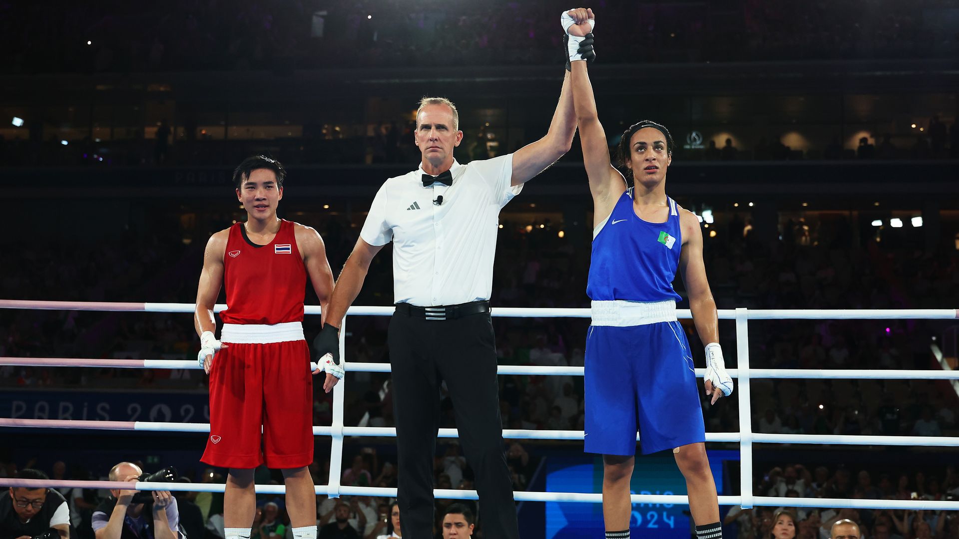 Match Referee Shawn Reese raises the arm of Imane Khelif of Team Algeria to announce the winner of the Women's 66kg Semifinal round match on day eleven of the Olympic Games Paris 2024 at Roland Garros on August 06, 2024.