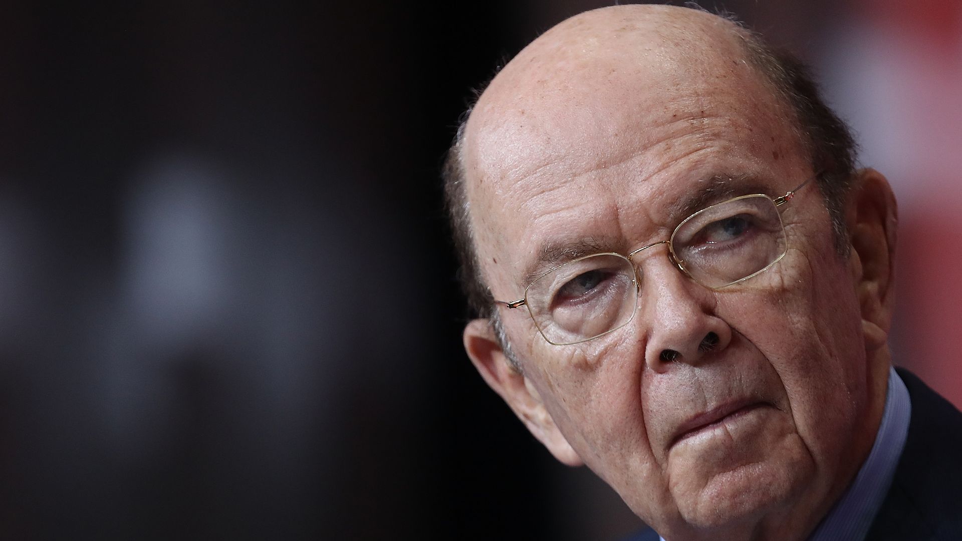 Wilbur Ross on the right side of the screen looks concerned