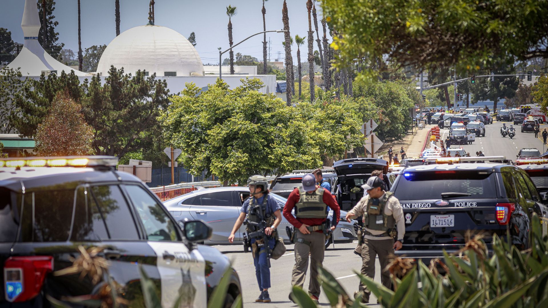 Police outside after two shooters fatally shot three people at the Islamic Center in San Diego Monday, May 18, 2026