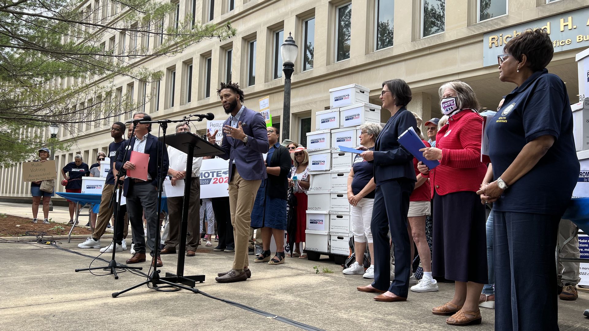 Michael Davis of Promote the Vote speaks in Lansing