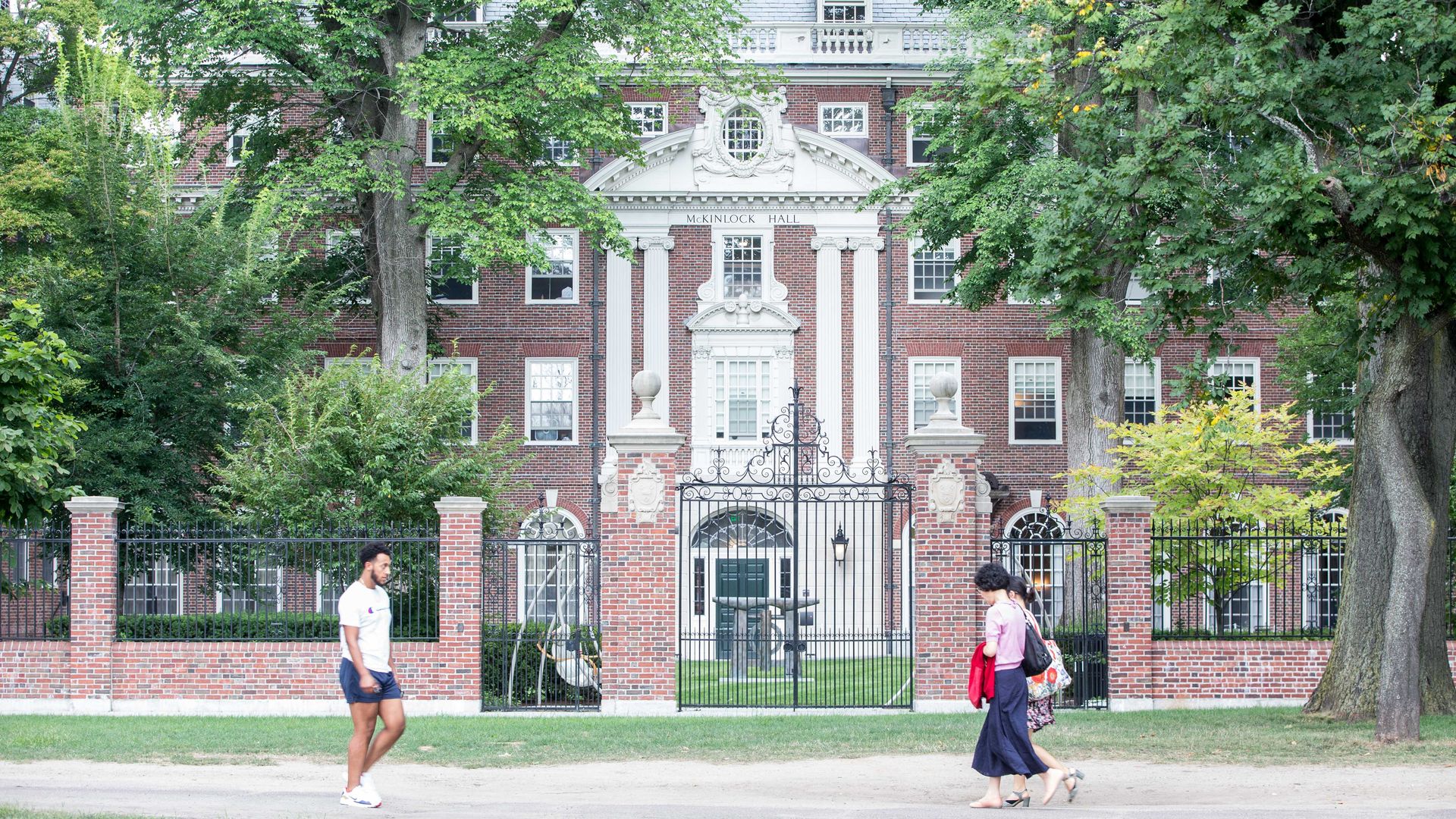  Pedestrians walk past a Harvard University building on August 30, 2018 in Cambridge, Massachusetts
