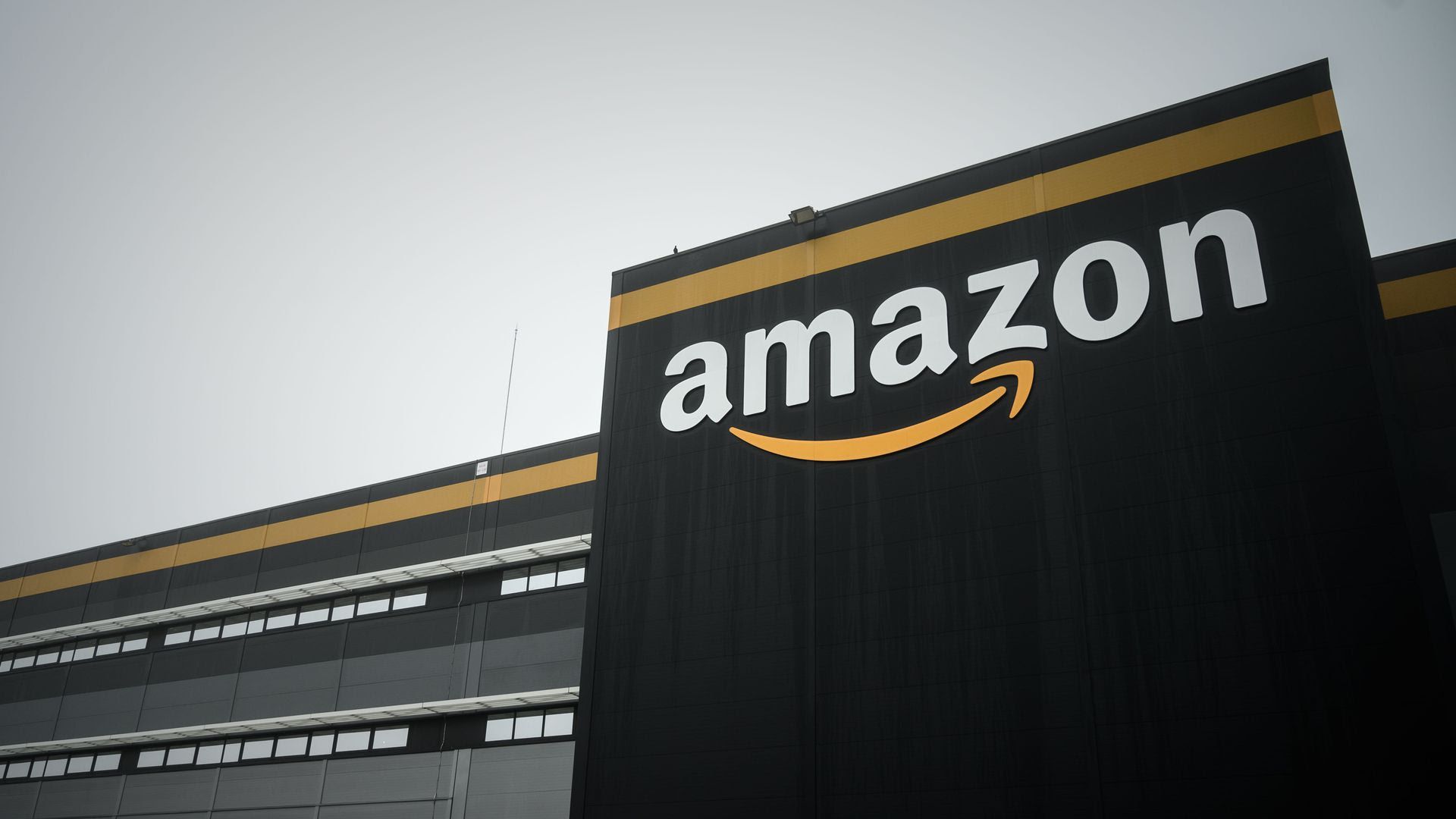 A wall with the Amazon logo on it.