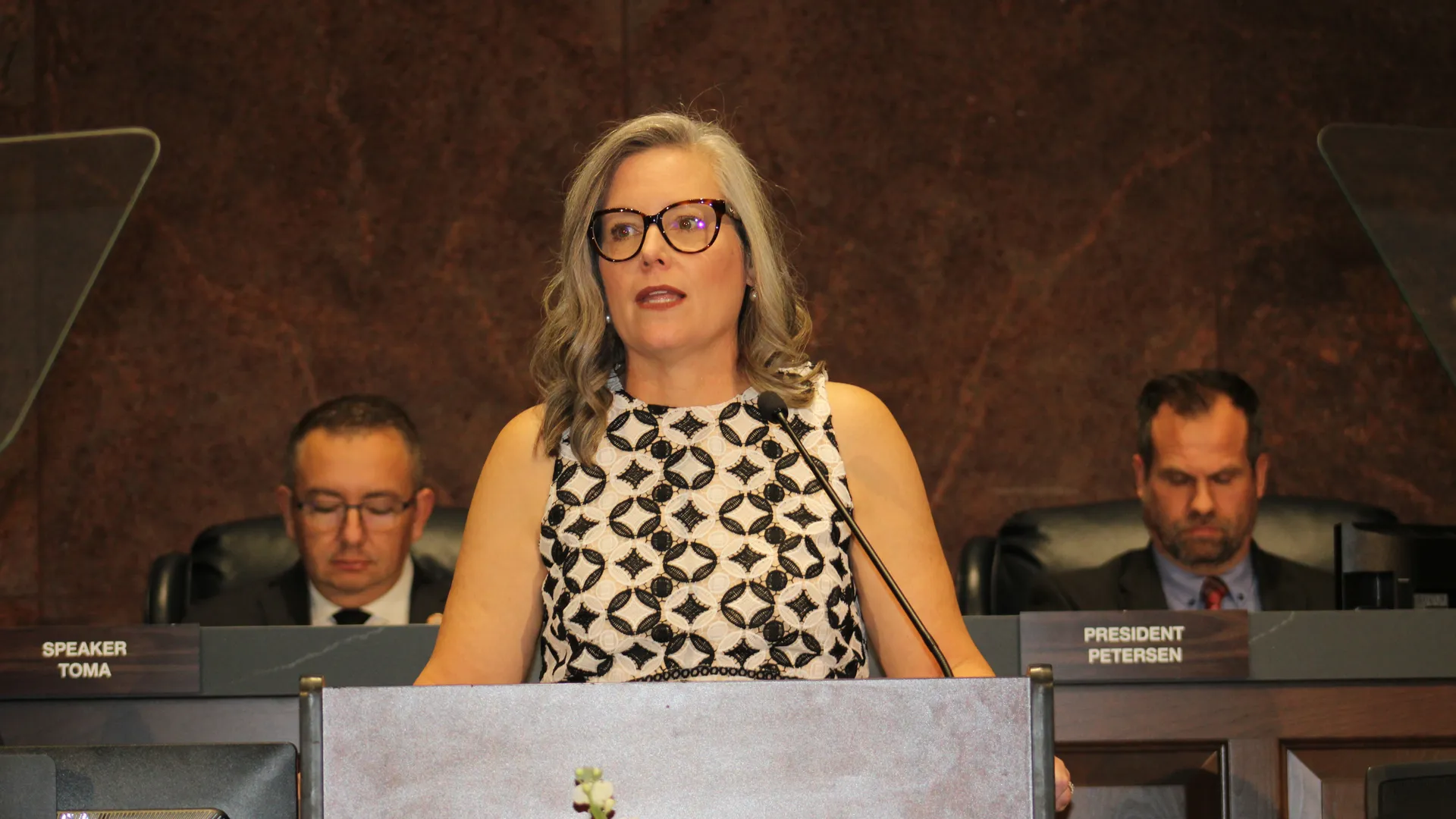 A woman speaking at a podium