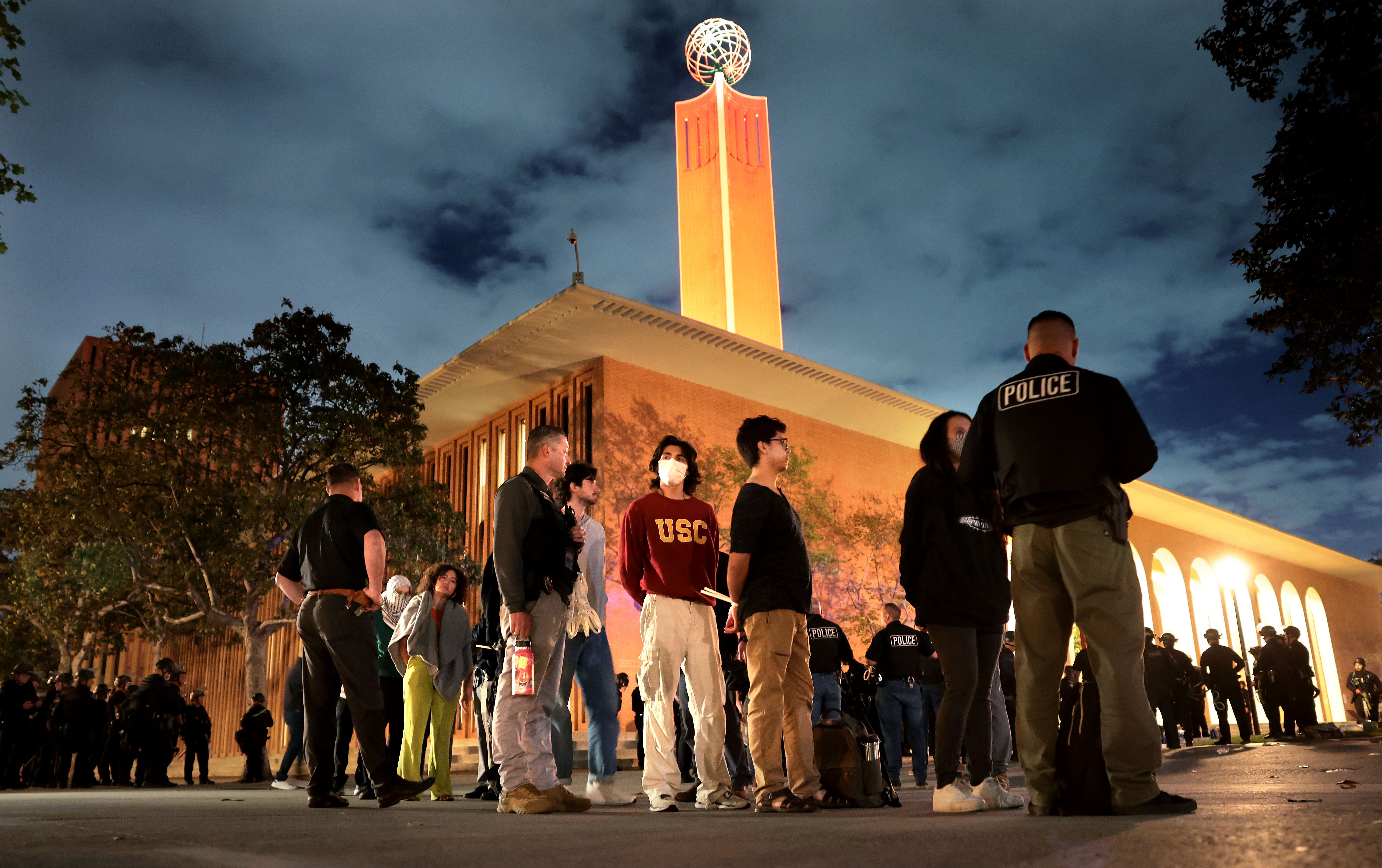 Protesters at USC are detained by LAPD officers who were trying to clear the campus during a demonstration against the war in Gaza.