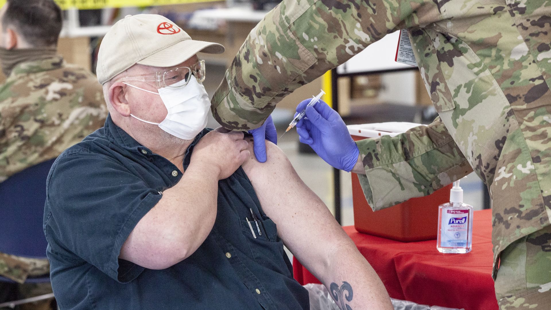 Senior citizen receives a Covid-19 vaccine as part of a collaborative effort from the West Virginia National Guard
