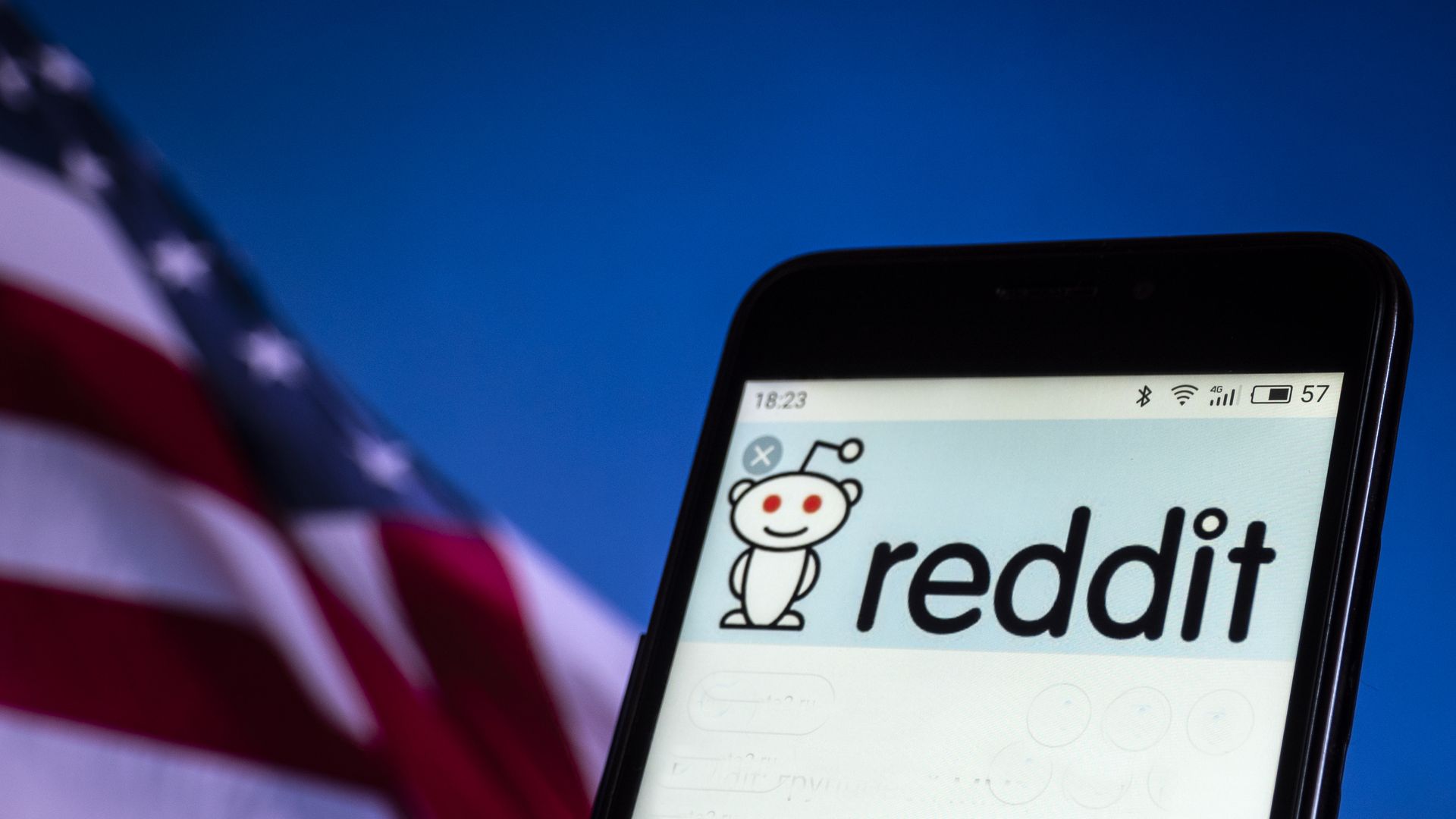 Reddit logo on a smartphone screen
