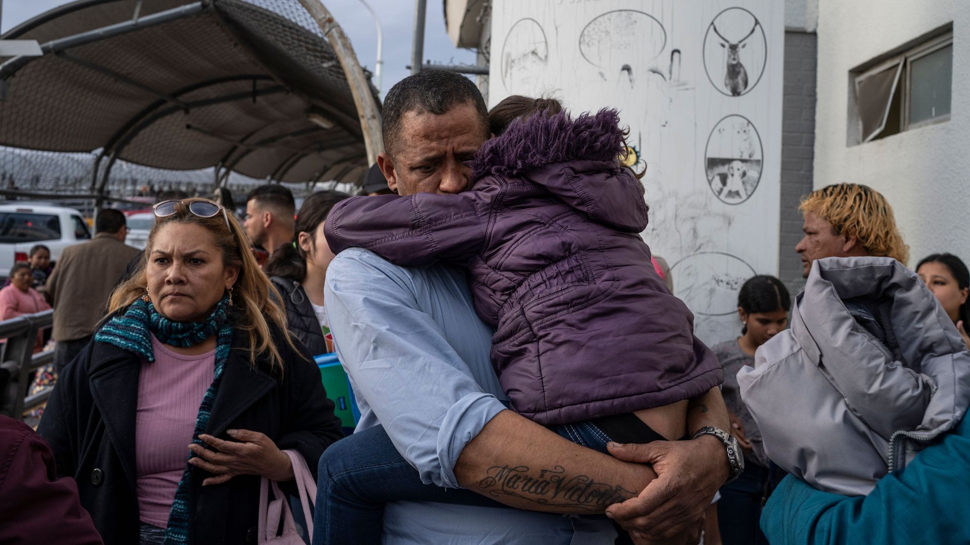 A man from Venezuela seeking asylum in the United States holds his daughter on February 28, 2020, in Ciudad Juárez.
