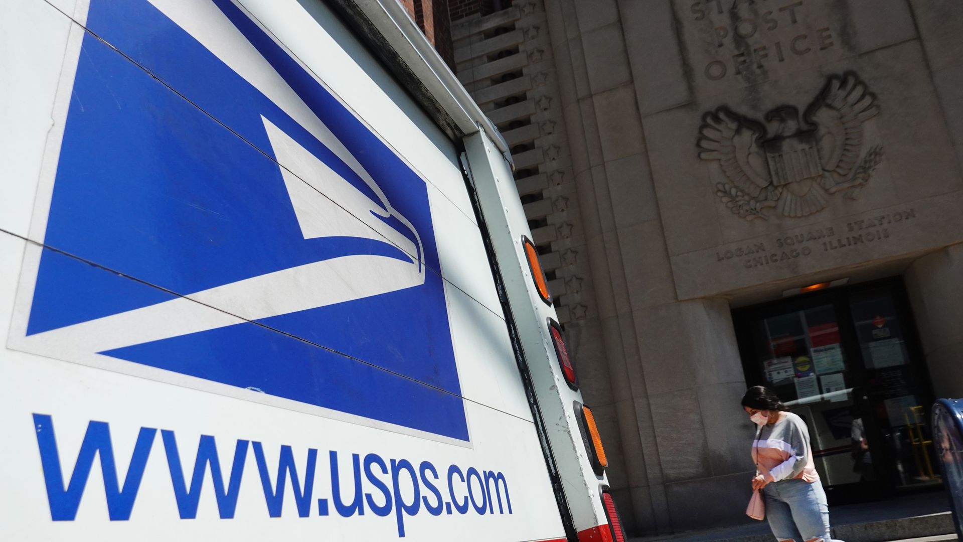 A postal vehicle in front of a United State Postal Service facility in Chicago on Aug. 13.