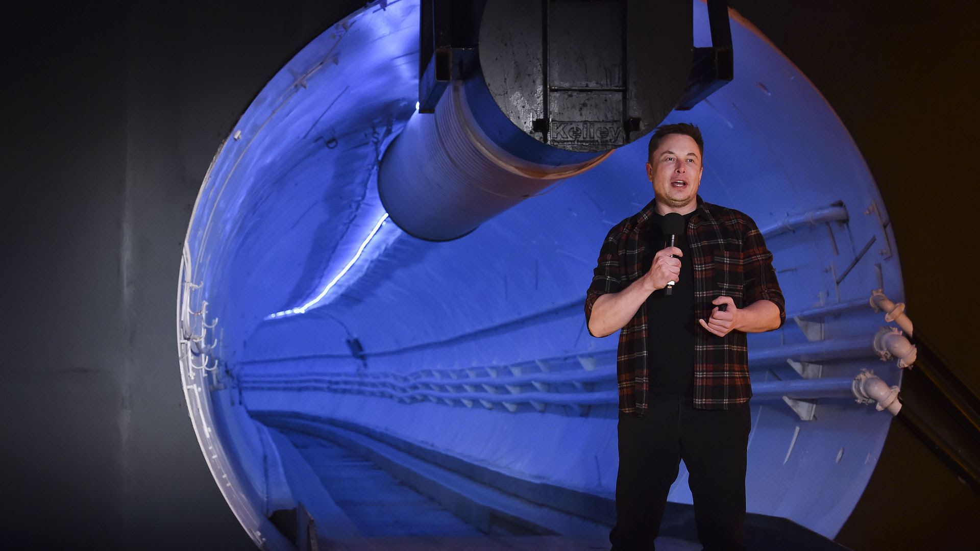 Elon Musk in front of a tunnel built by his Boring Company