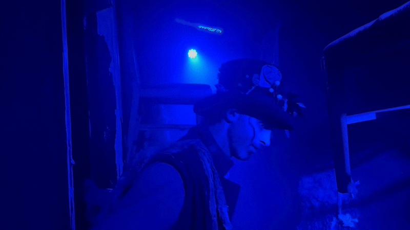 Axios reporter Travis dressed up as a Halloween Haunt scare actor slowly turns his head and creepily smiles at the camera, played in a loop back and forth.