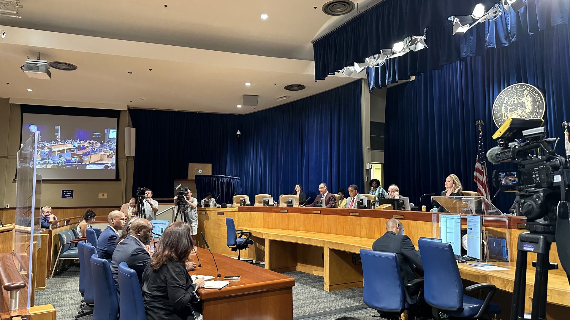 Photo shows Entergy officials in front of New Orleans City Council