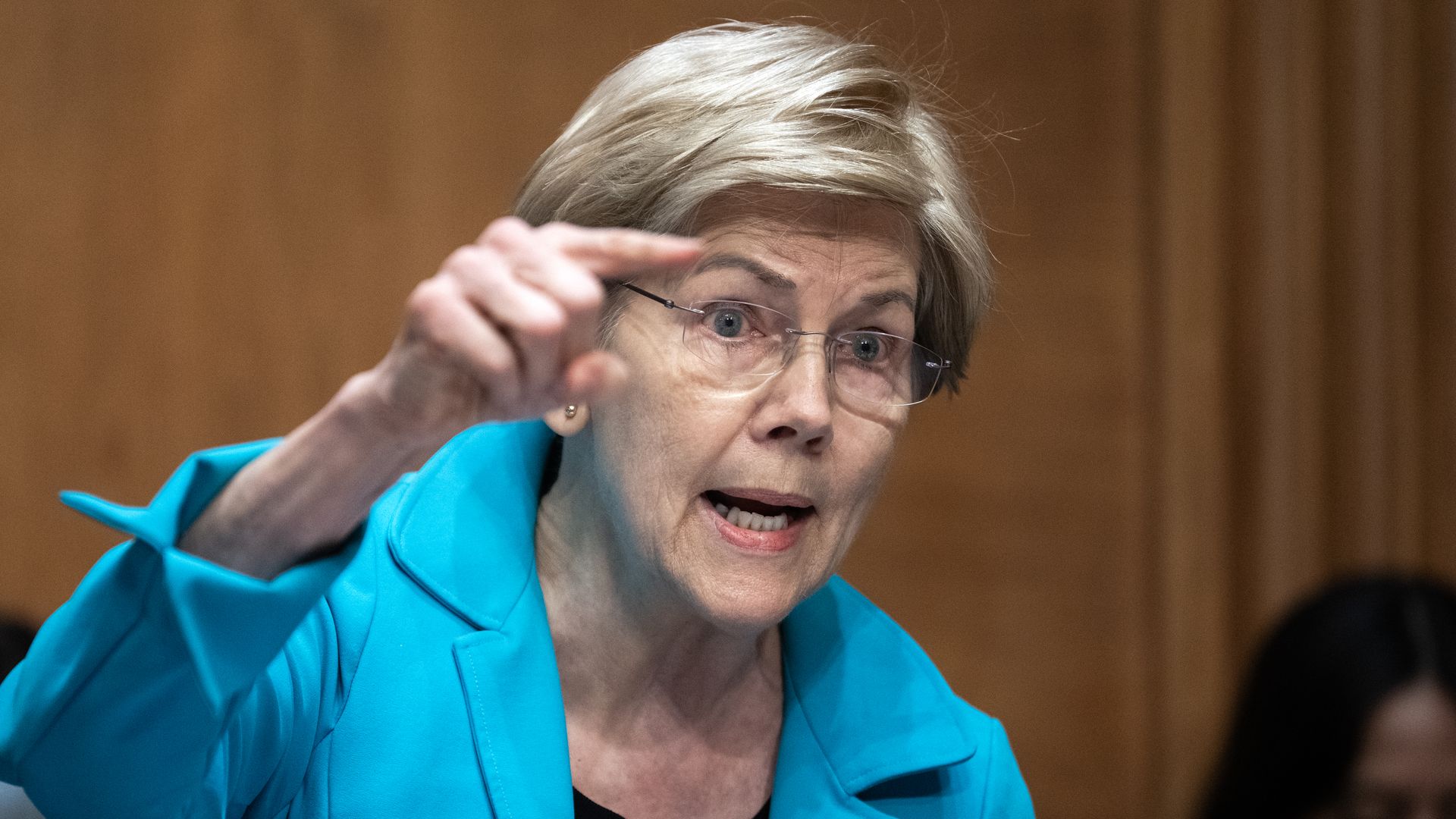 Elizabeth Warren points while talking during a hearing.