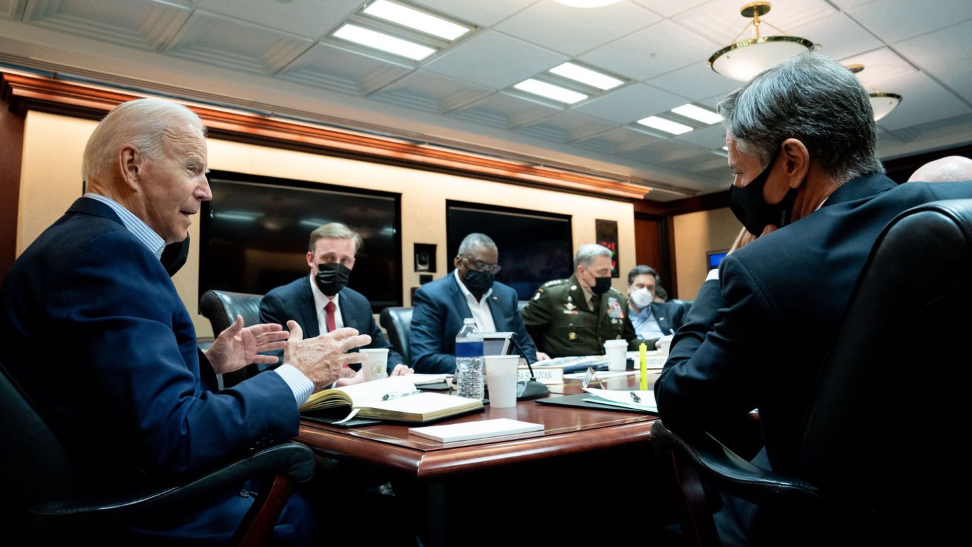 Biden speaks to members of his staff.