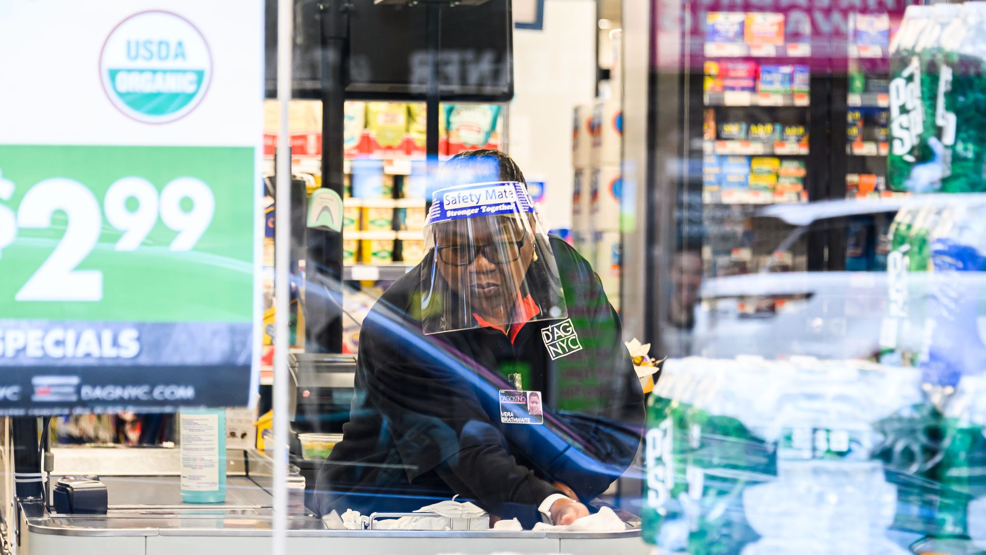 A worker wears a face mask in a D'Agostino supermarket in Murray Hill as New York City moves into Phase 2 of re-opening following restrictions imposed to curb the coronavirus pandemic on June 30, 2020