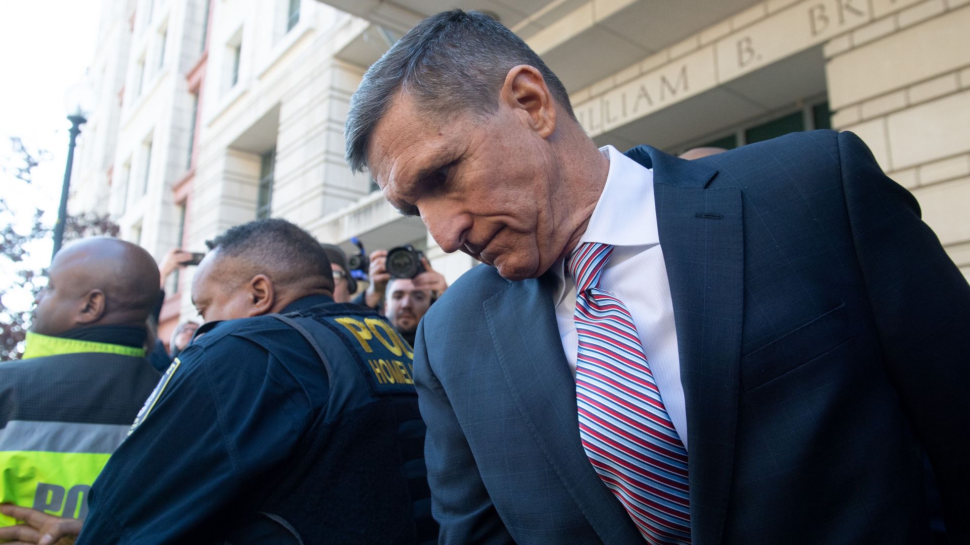 Michael Flynn leaves a courthouse 