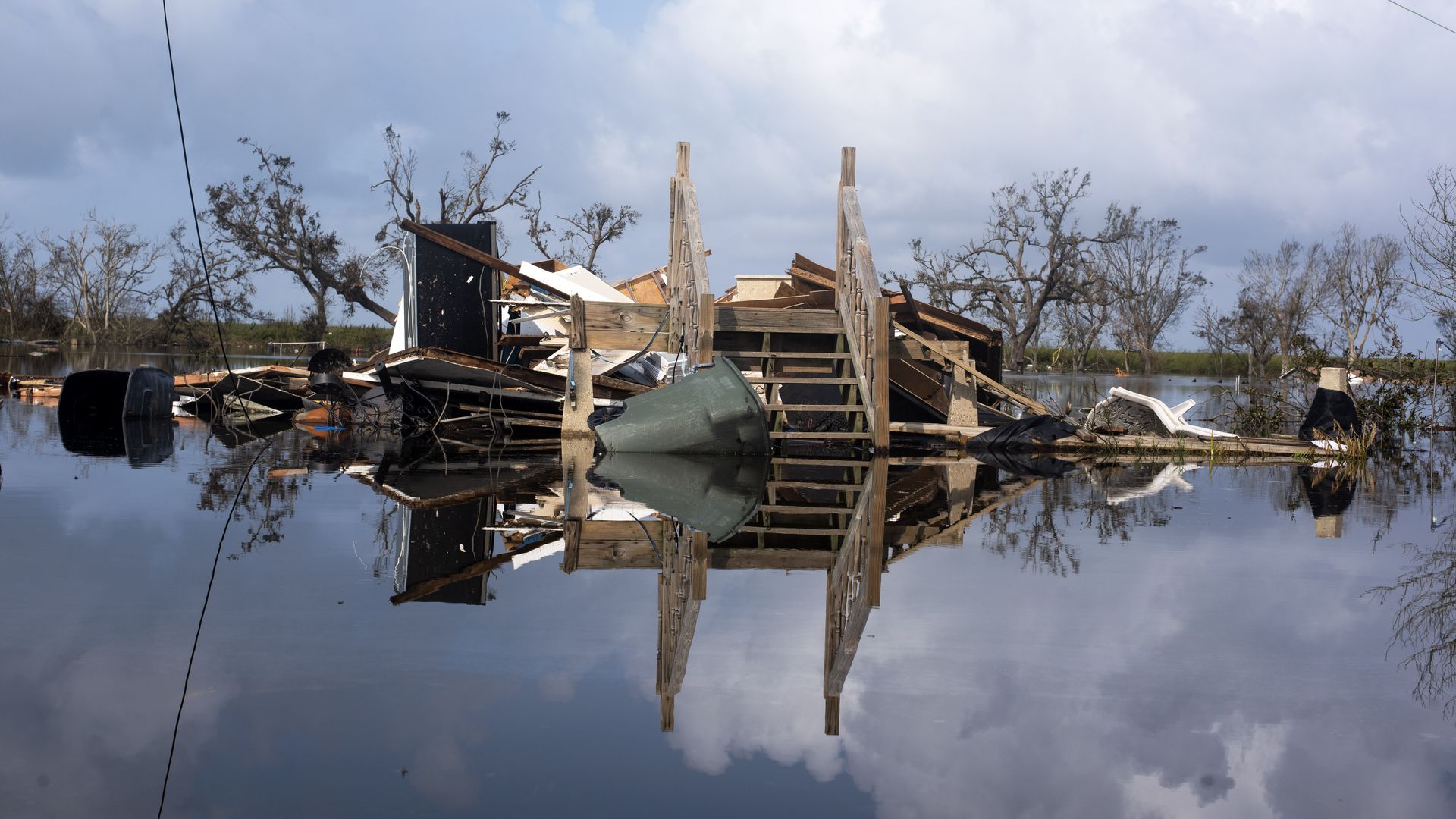 Photo of a destroyed home in floodwater 